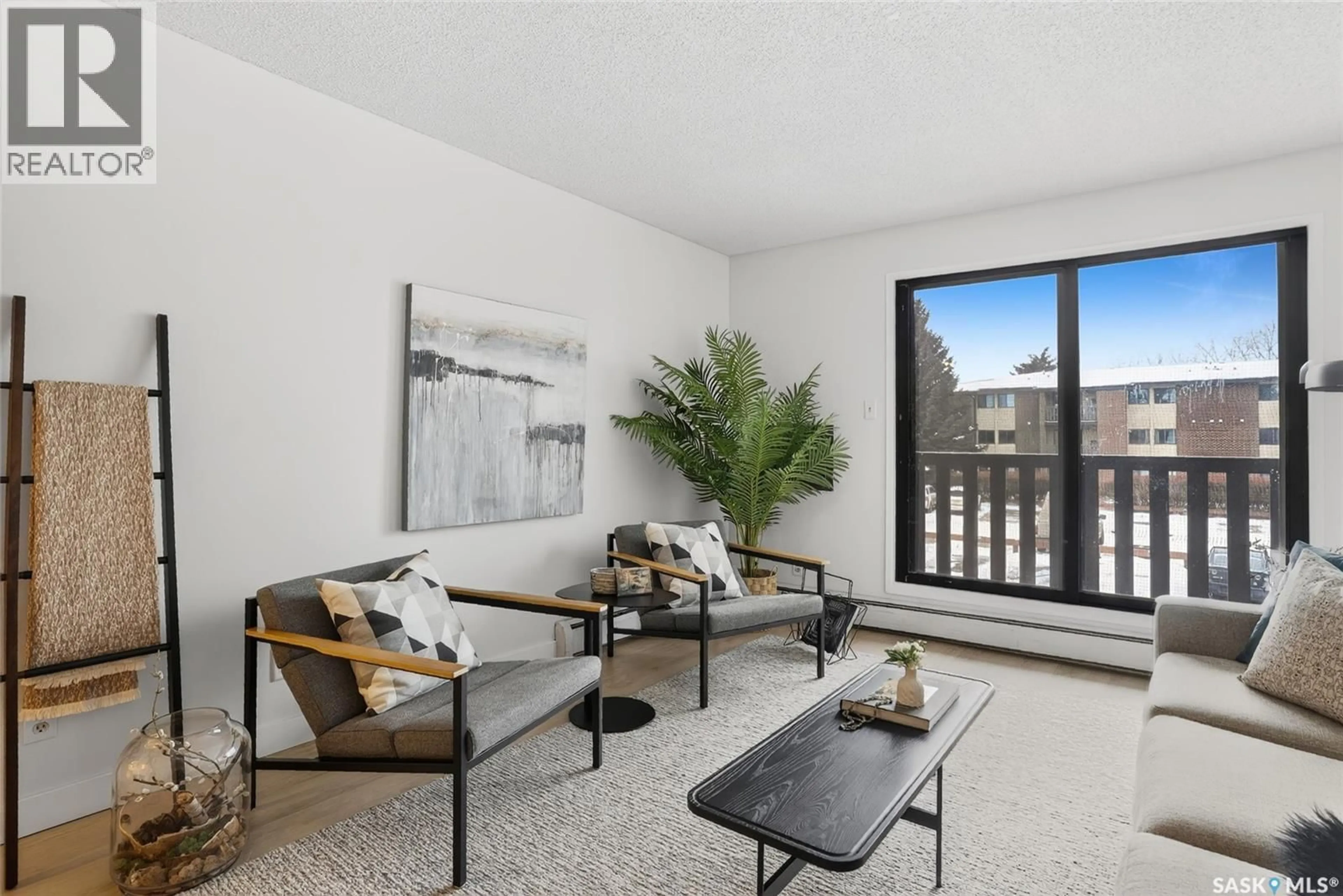 Living room with furniture, unknown for 208 311 TAIT CRESCENT, Saskatoon Saskatchewan S7H5L6