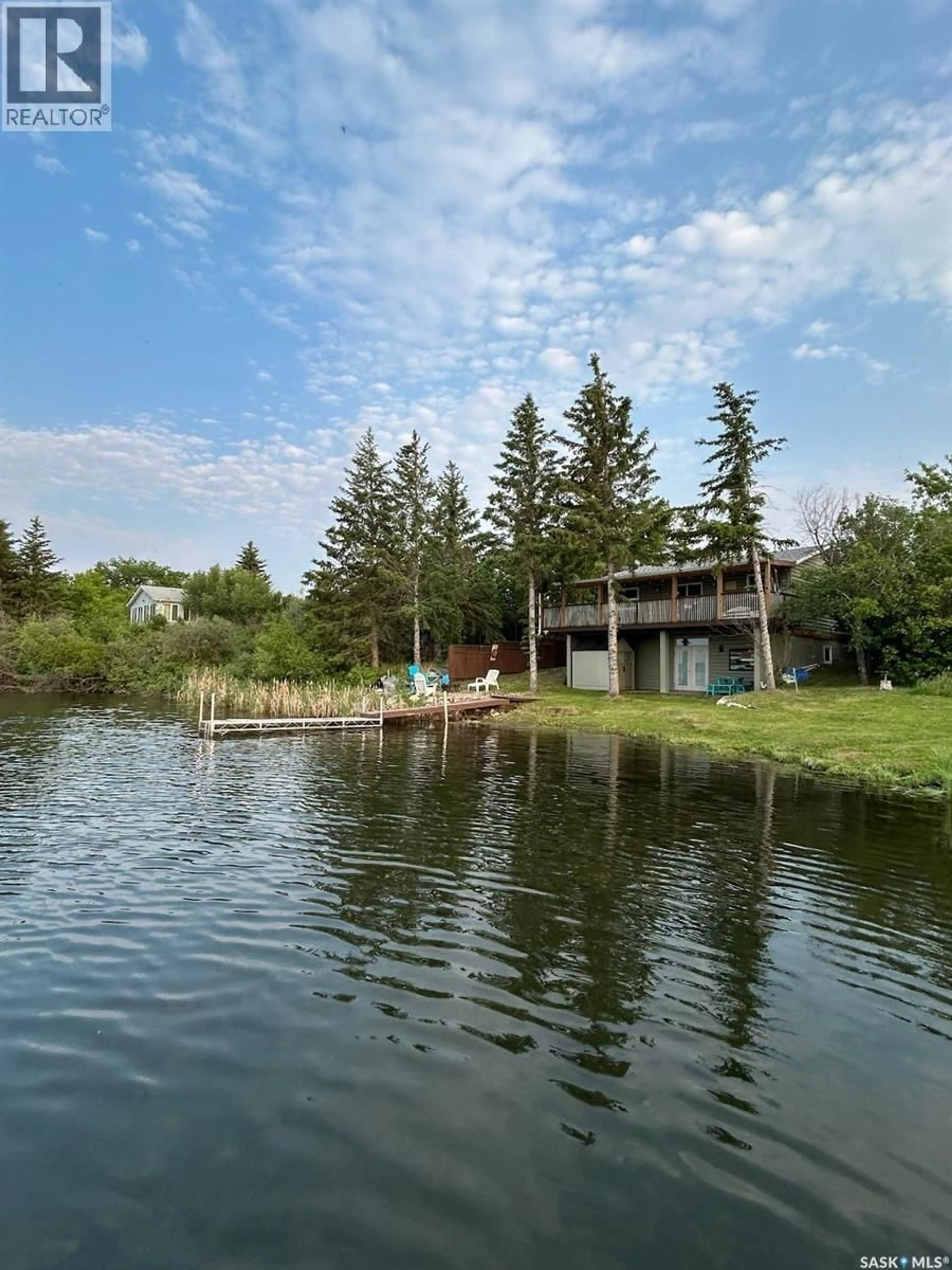 A pic from outside/outdoor area/front of a property/back of a property/a pic from drone, water/lake/river/ocean view for 3829 FIRST POINT BEACH DRIVE, Hoodoo Rm No. 401 Saskatchewan S0K4P0