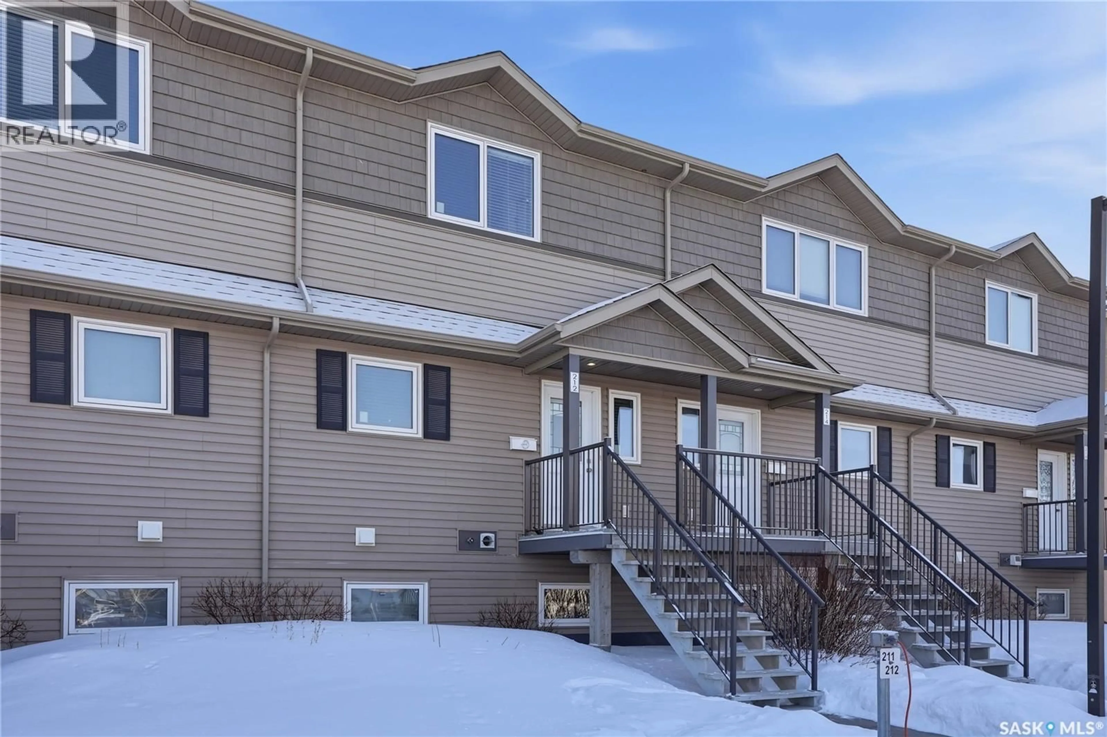 Home with vinyl exterior material, street for 115 - 212 DALGLEISH LINK, Saskatoon Saskatchewan S7W0N5