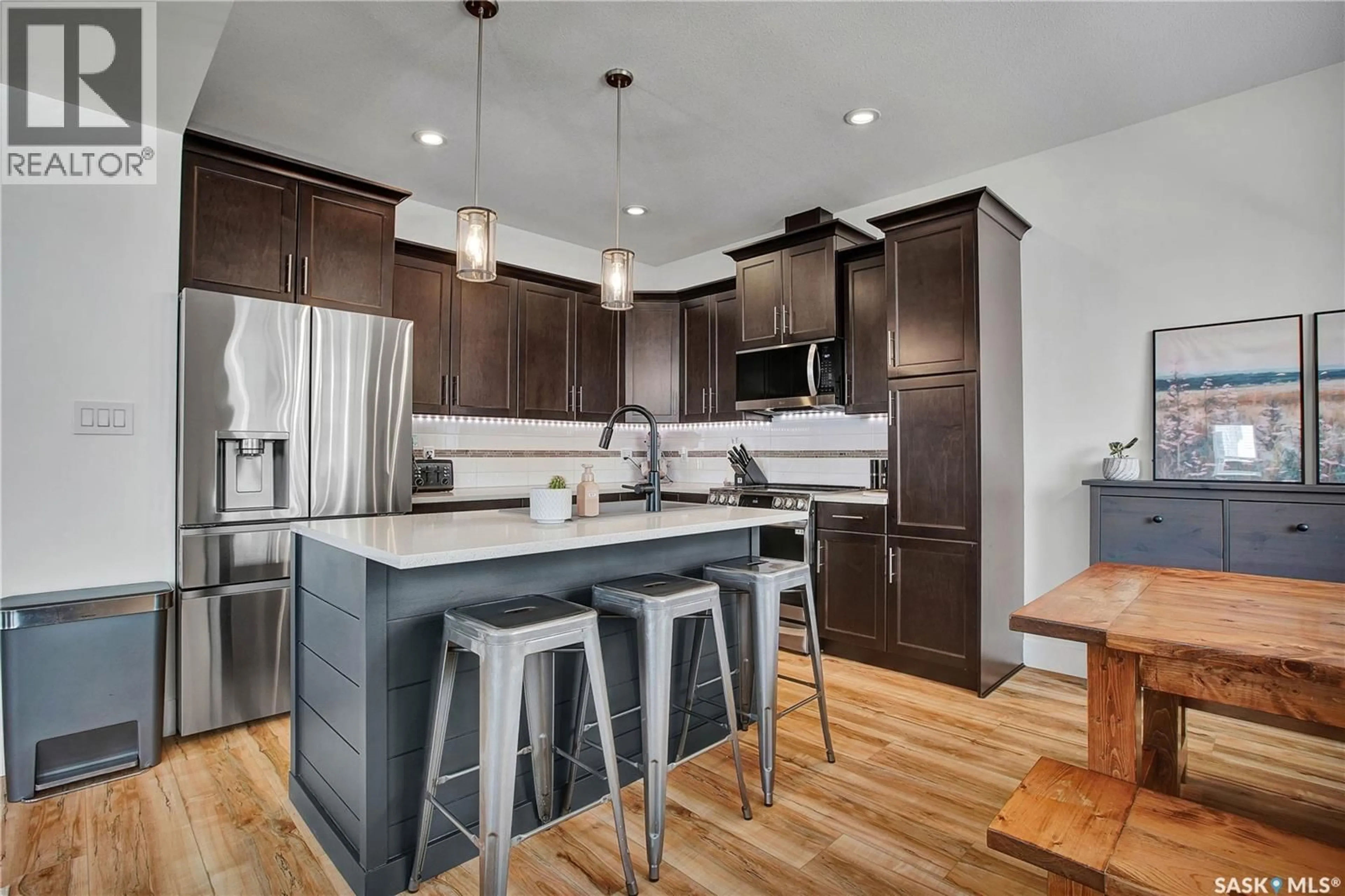 Open concept kitchen, wood/laminate floor for 13 600 MAPLE CRESCENT, Warman Saskatchewan S0K4S2