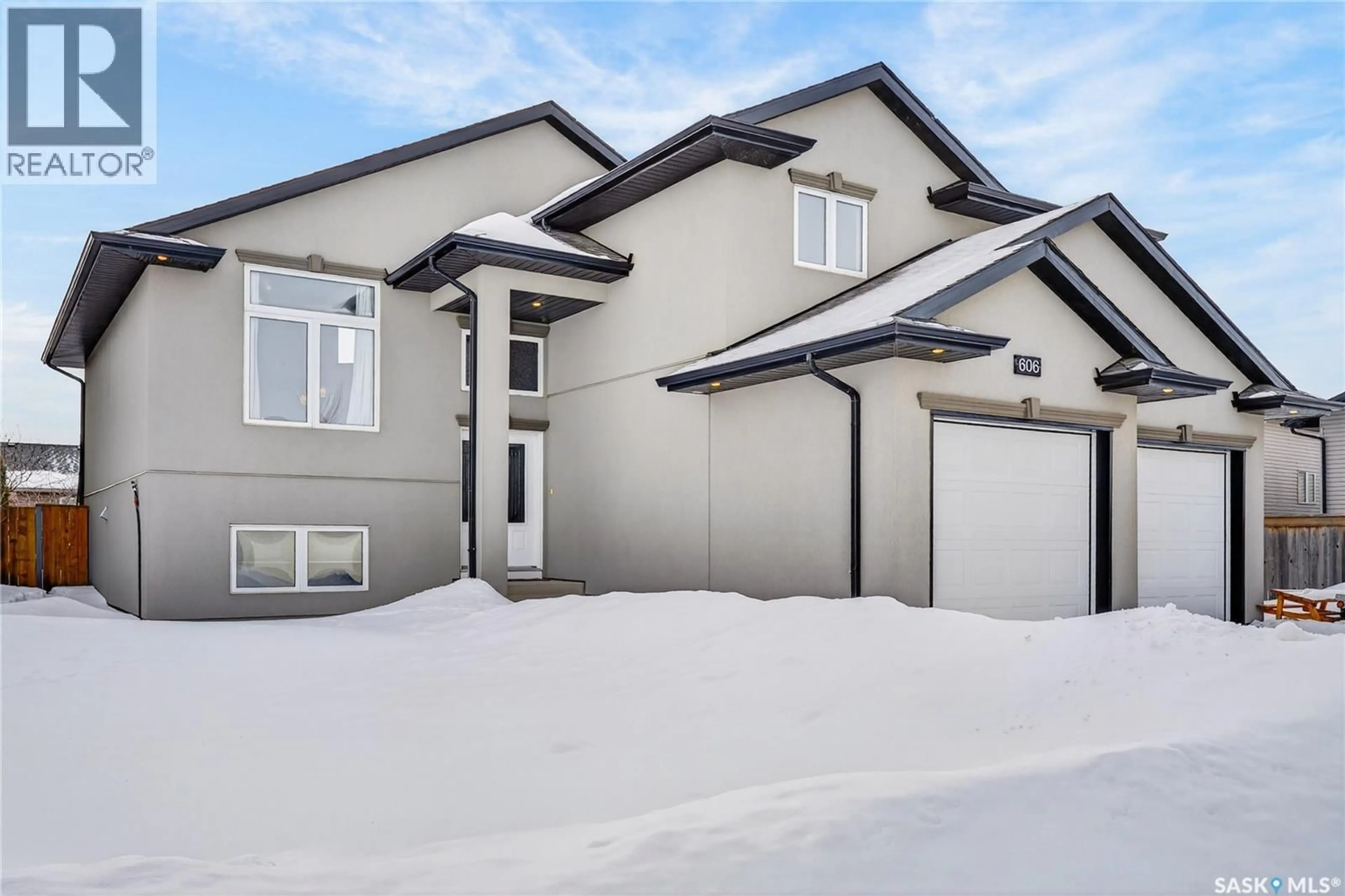 Home with vinyl exterior material, street for 606 HARGREAVES LANE, Saskatoon Saskatchewan S7R0H7