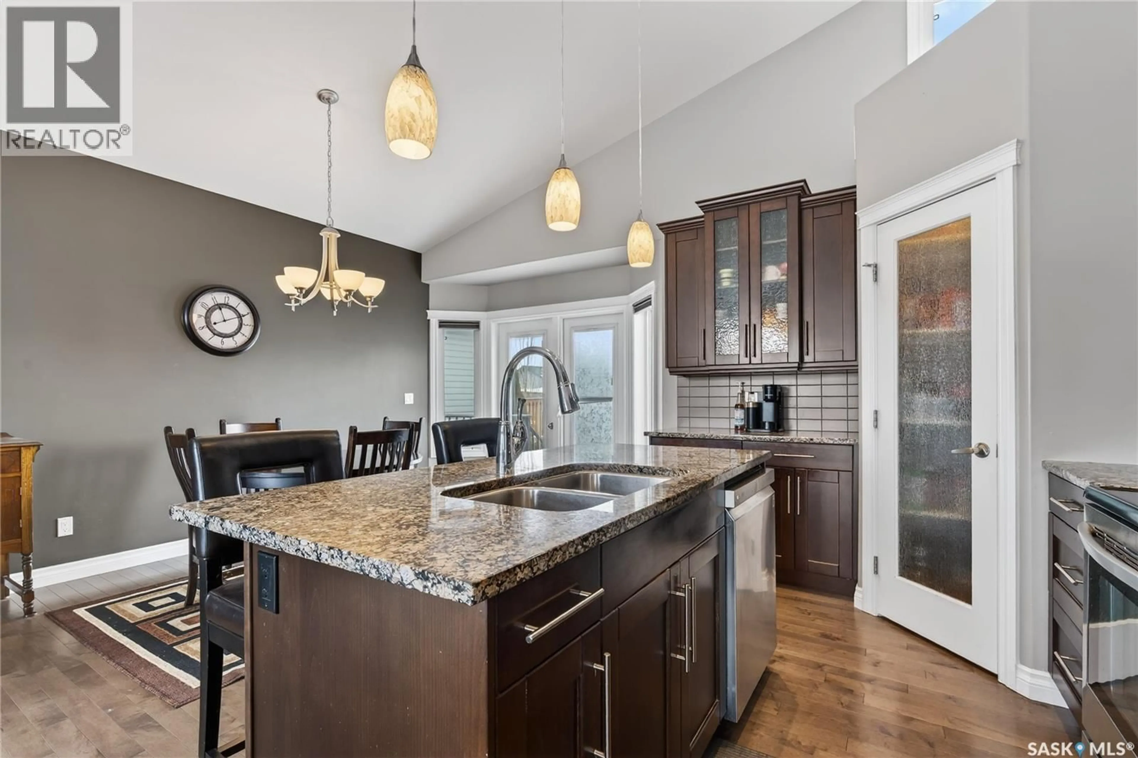 Open concept kitchen, ceramic/tile floor for 606 HARGREAVES LANE, Saskatoon Saskatchewan S7R0H7