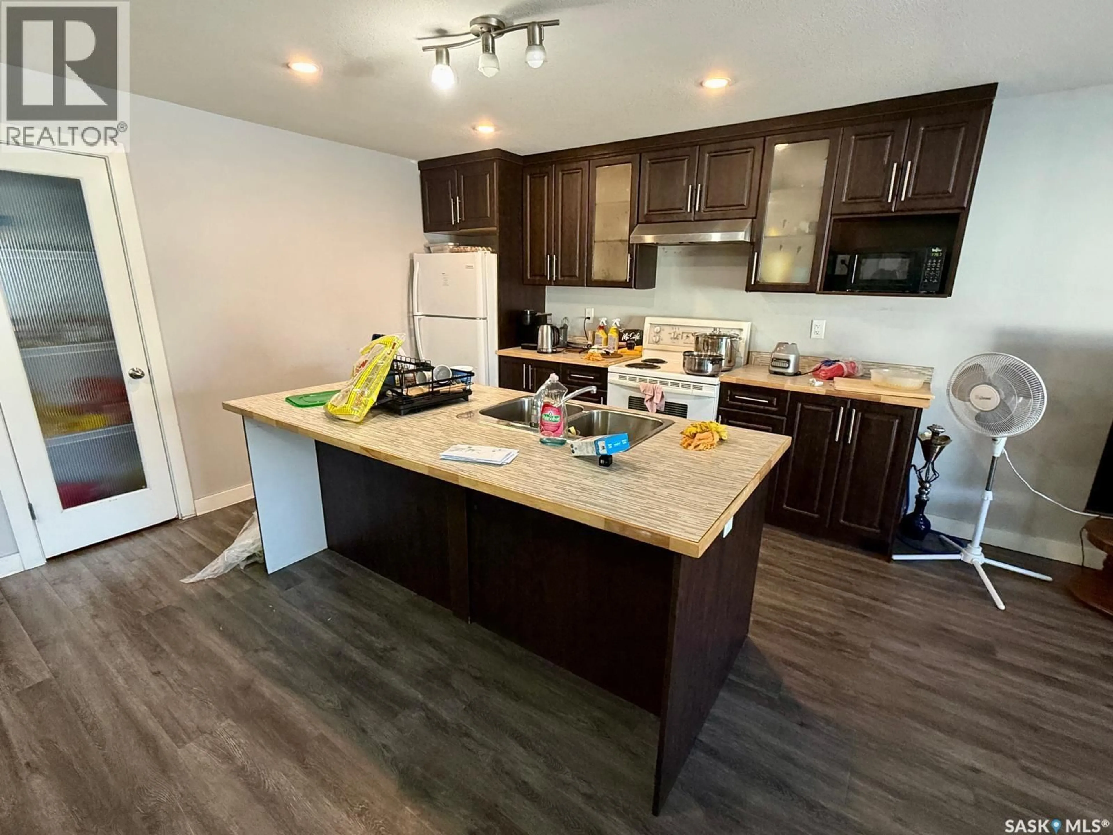 Open concept kitchen, wood/laminate floor for 2264 MONTREAL STREET, Regina Saskatchewan S4P1L6