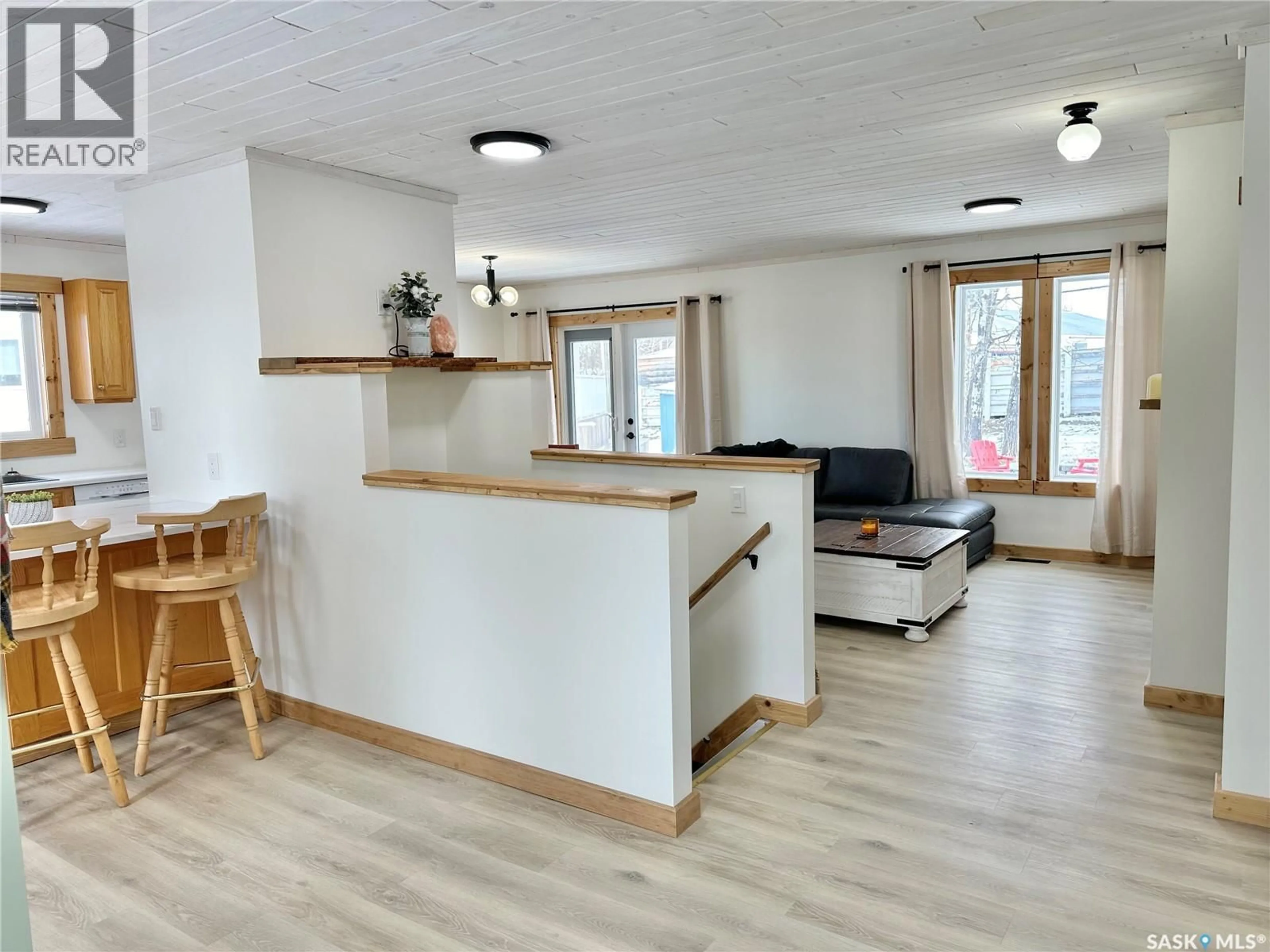 Living room with furniture, wood/laminate floor for 3 MORROW PLACE, Shell Lake Saskatchewan S0J2G0