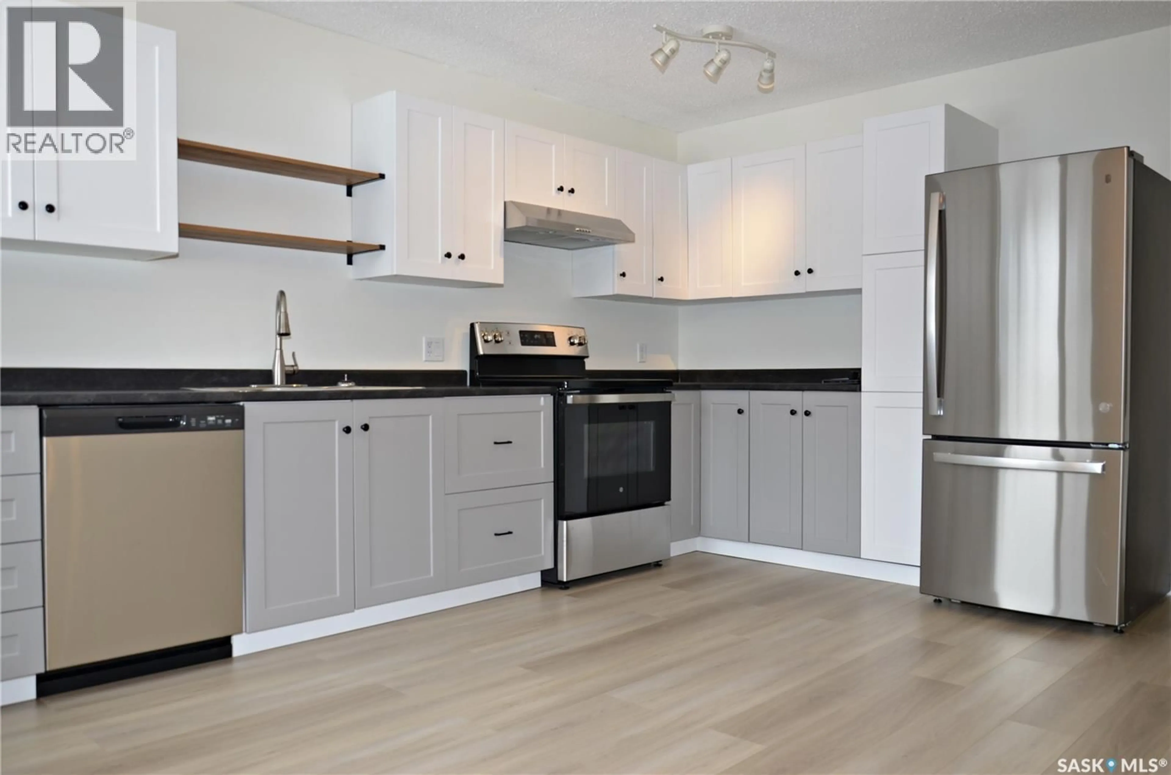 Open concept kitchen, wood/laminate floor for 209 TORRAN STREET, Colonsay Saskatchewan S0K0Z6