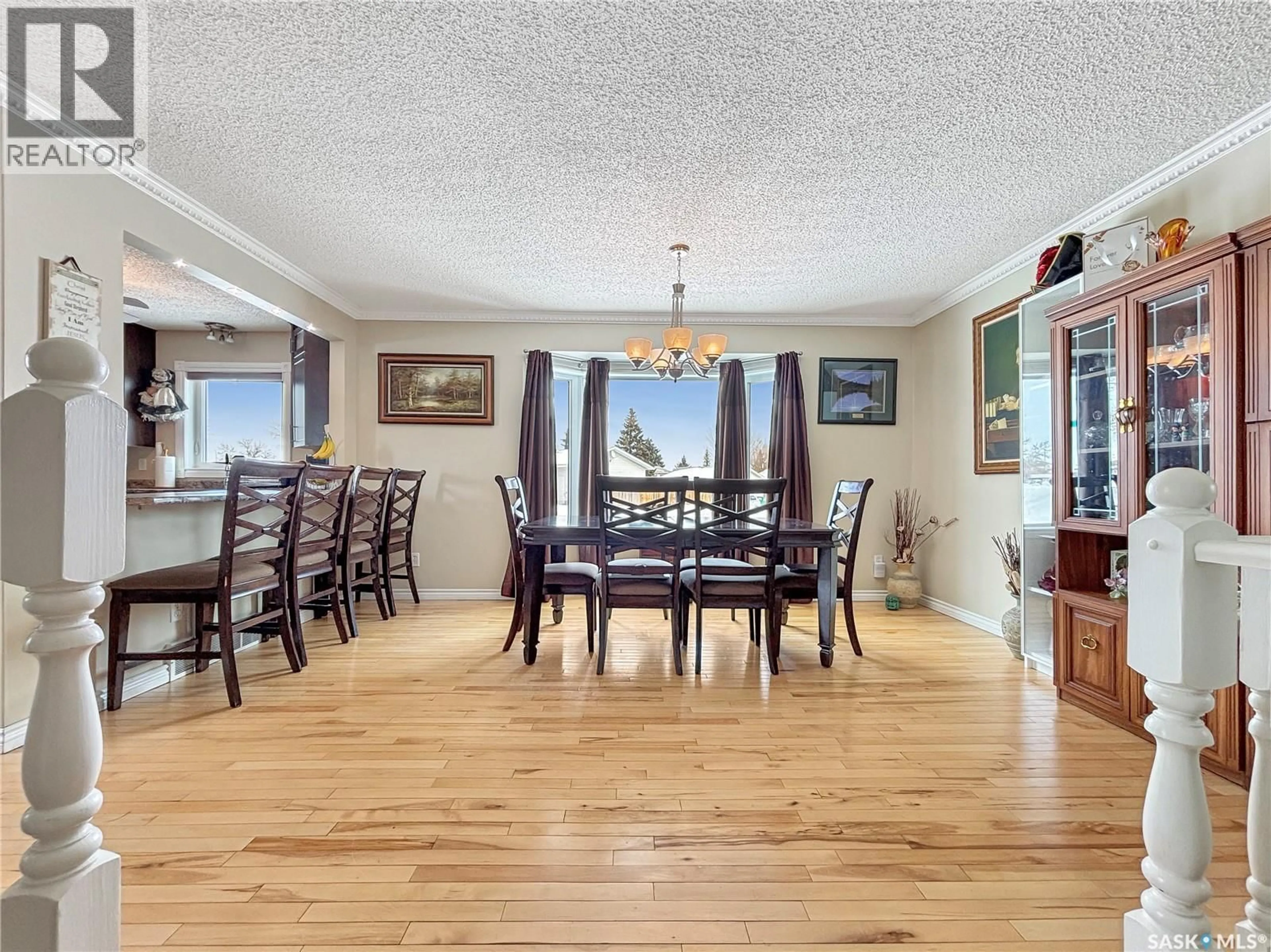 Dining room, wood/laminate floor for 247 STACEY CRESCENT, Saskatoon Saskatchewan S7L7A9