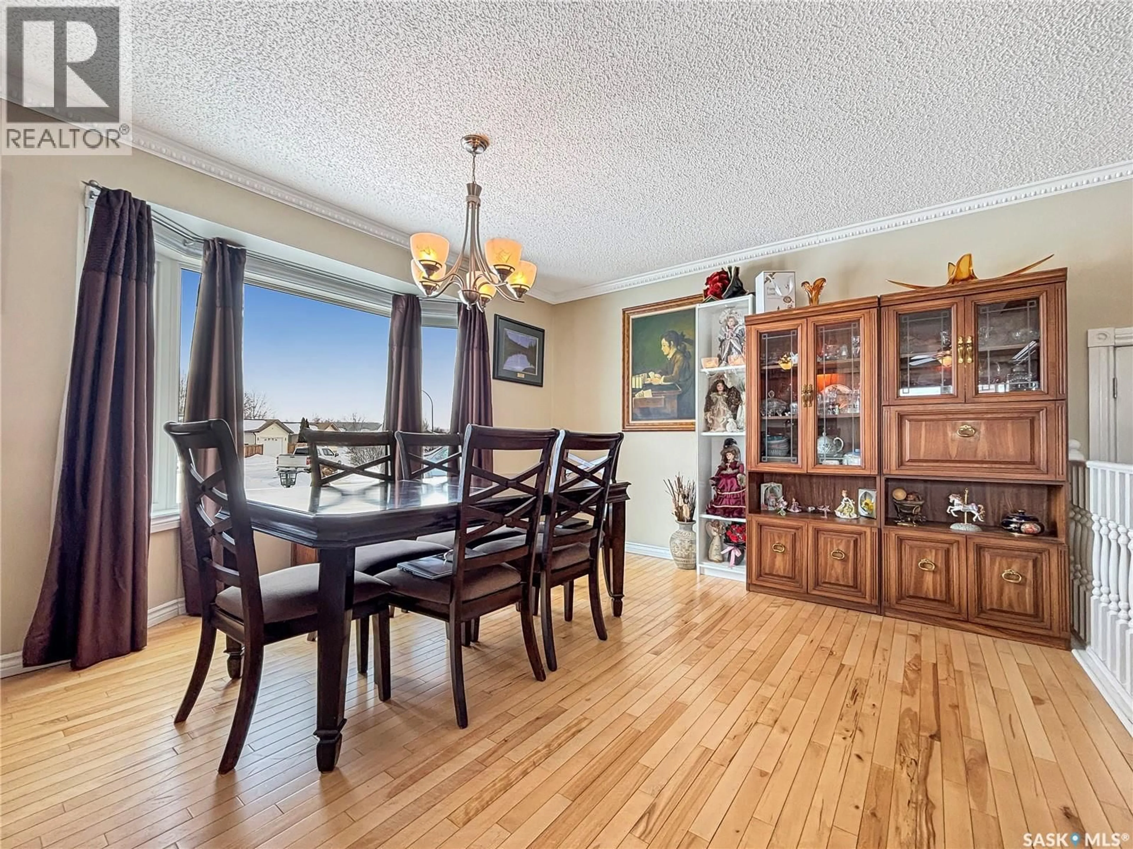 Dining room, wood/laminate floor for 247 STACEY CRESCENT, Saskatoon Saskatchewan S7L7A9