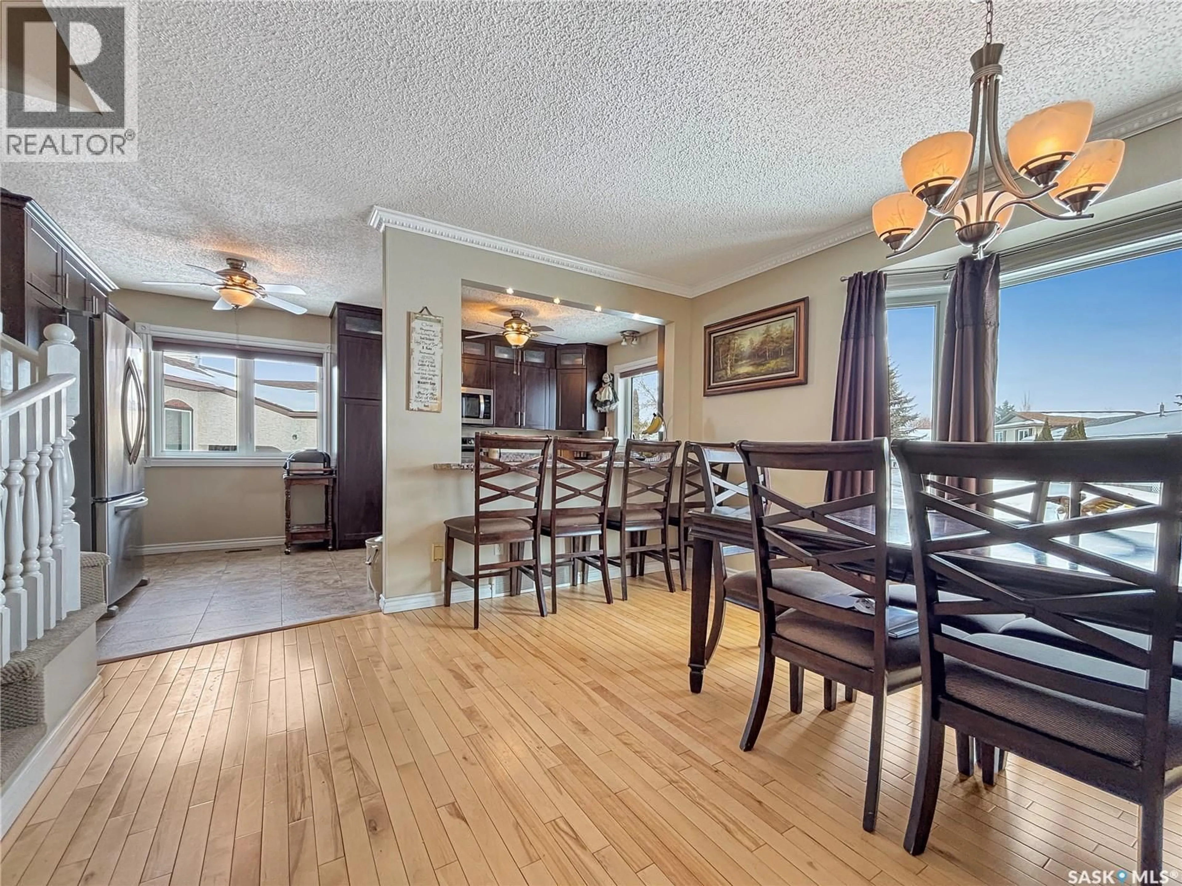 Dining room, wood/laminate floor for 247 STACEY CRESCENT, Saskatoon Saskatchewan S7L7A9