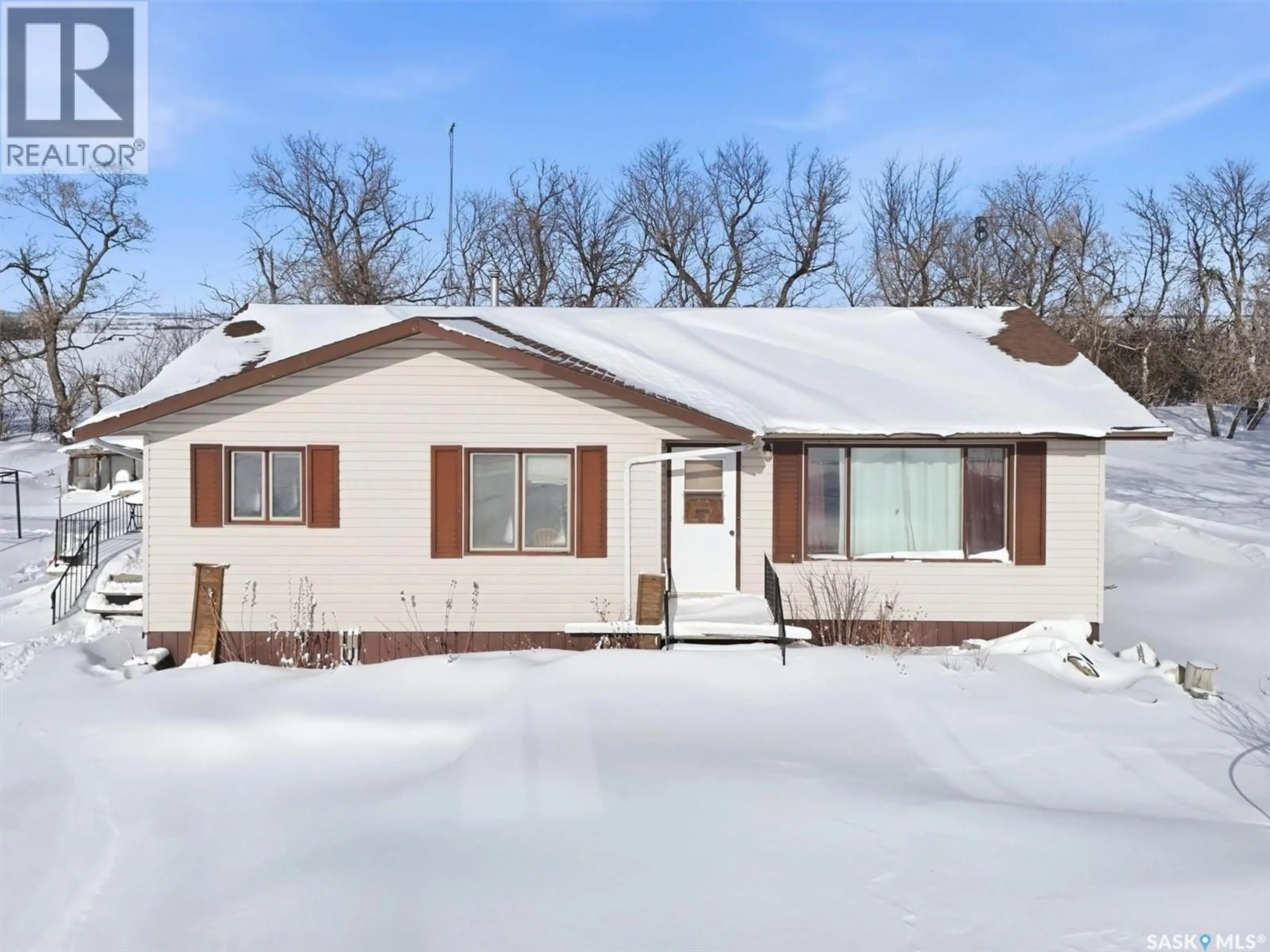 Home with vinyl exterior material, street for LOMASZKIEWICZ ACREAGE, Aberdeen Rm No. 373 Saskatchewan S0K0A0