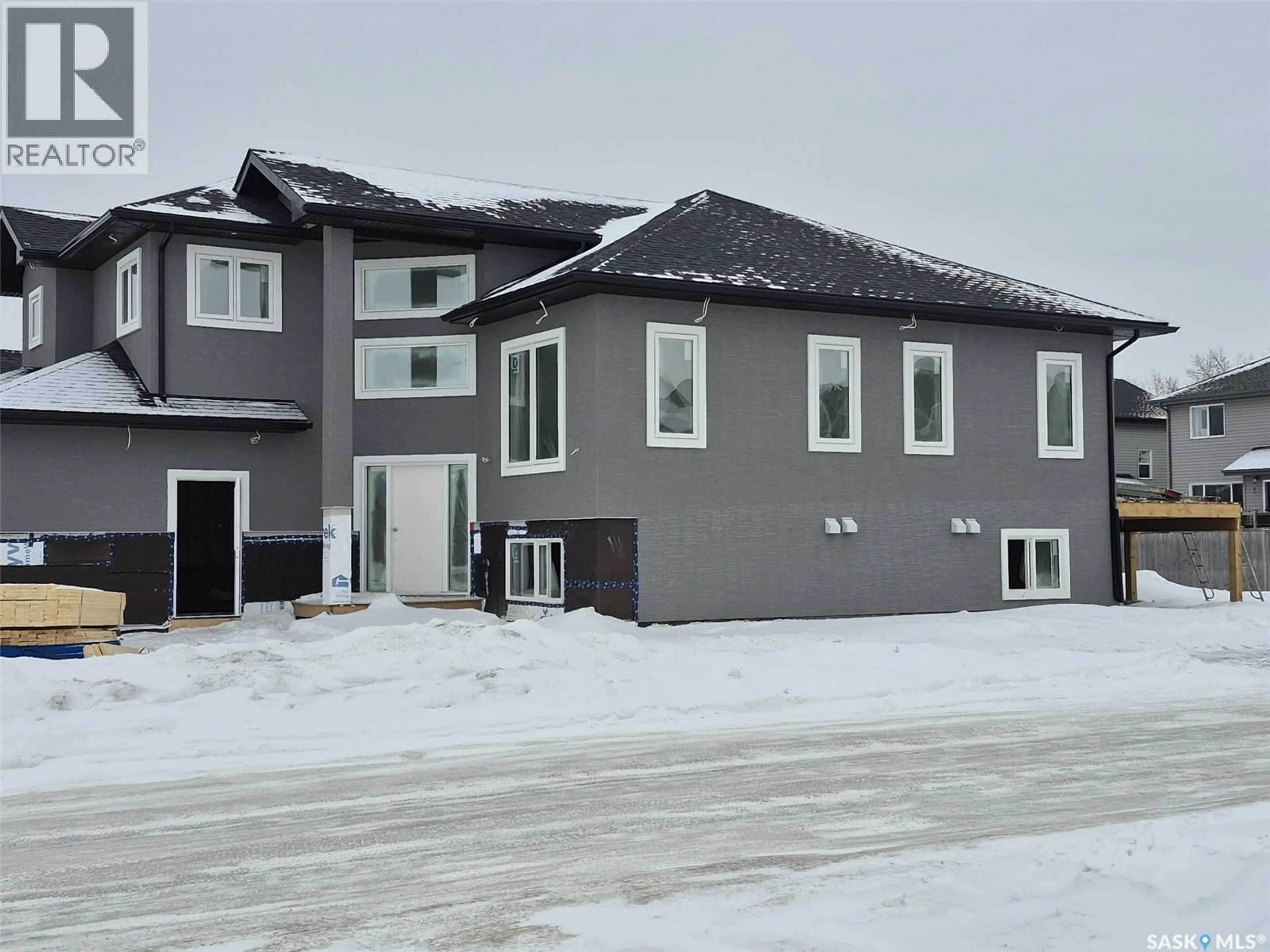 Home with vinyl exterior material, street for 231 LEHRER PLACE, Saskatoon Saskatchewan S7R0L4