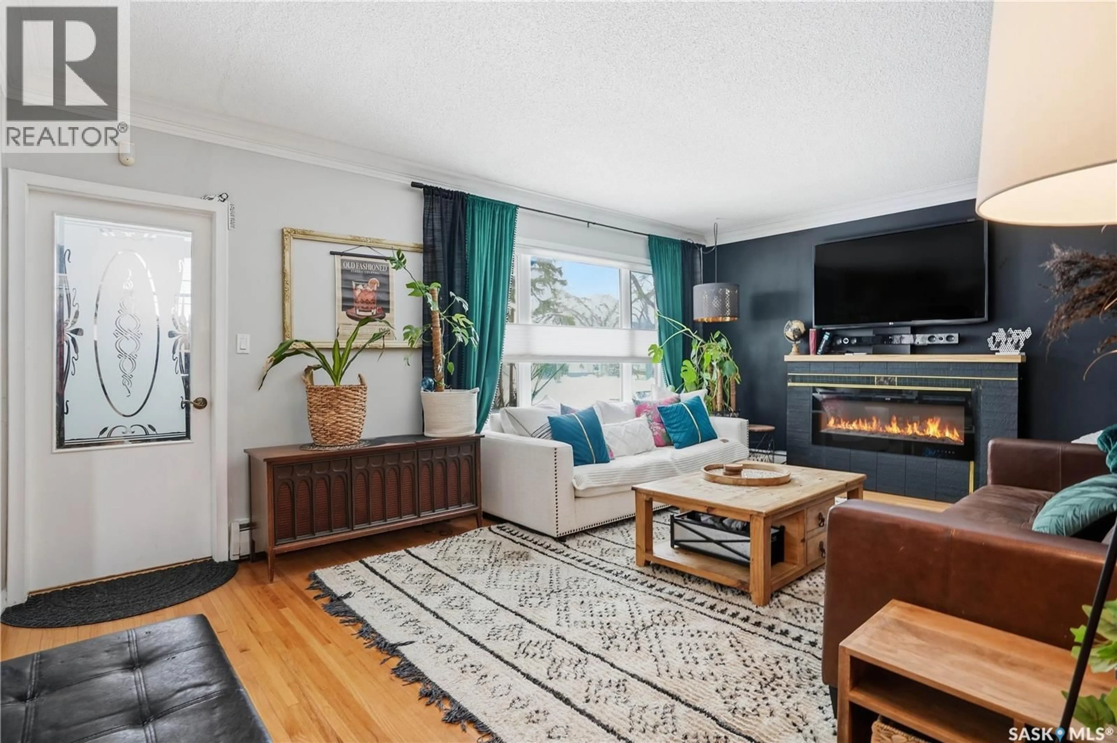 Living room with furniture, wood/laminate floor for 2804 HILL AVENUE, Regina Saskatchewan S4S0V7