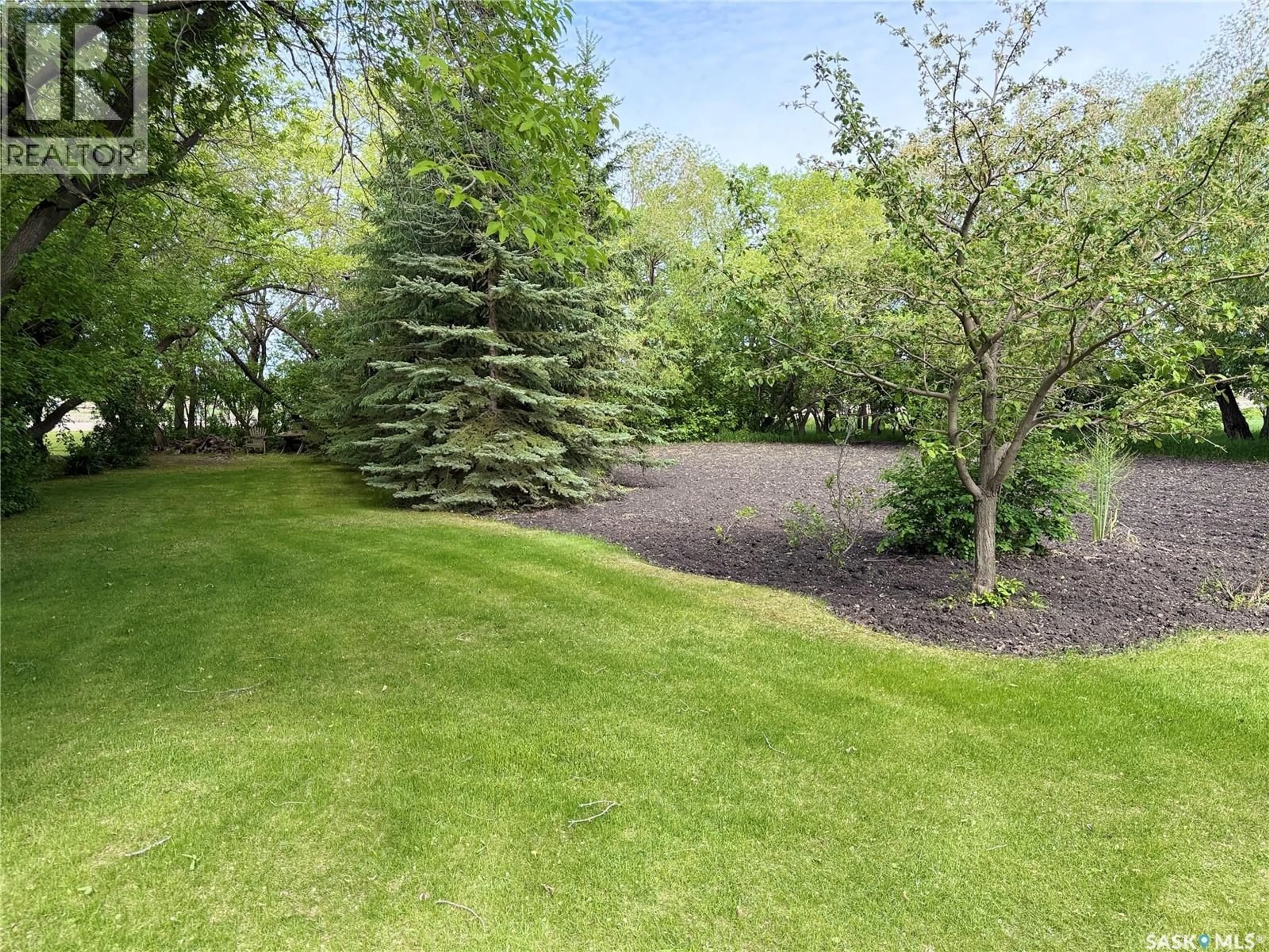 A pic from outside/outdoor area/front of a property/back of a property/a pic from drone, forest/trees view for 101 DOEPKER AVENUE, Annaheim Saskatchewan S0K0G0