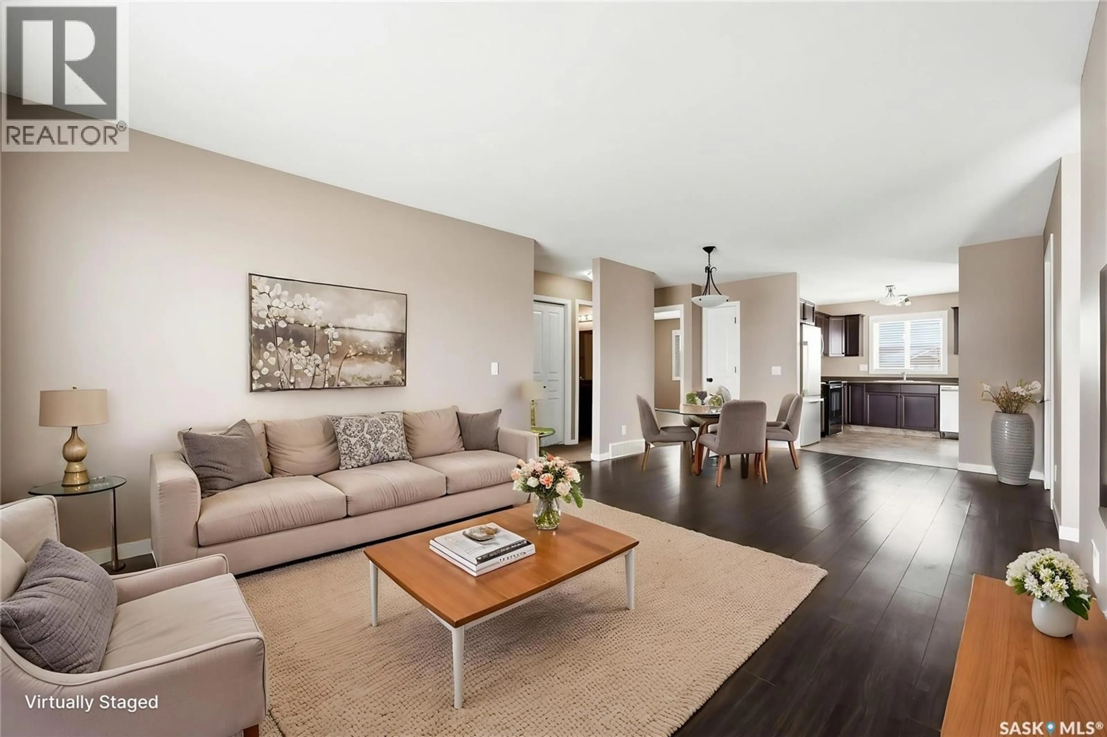 Living room with furniture, wood/laminate floor for 10 - 5004 JAMES HILL ROAD, Regina Saskatchewan S4W0E8