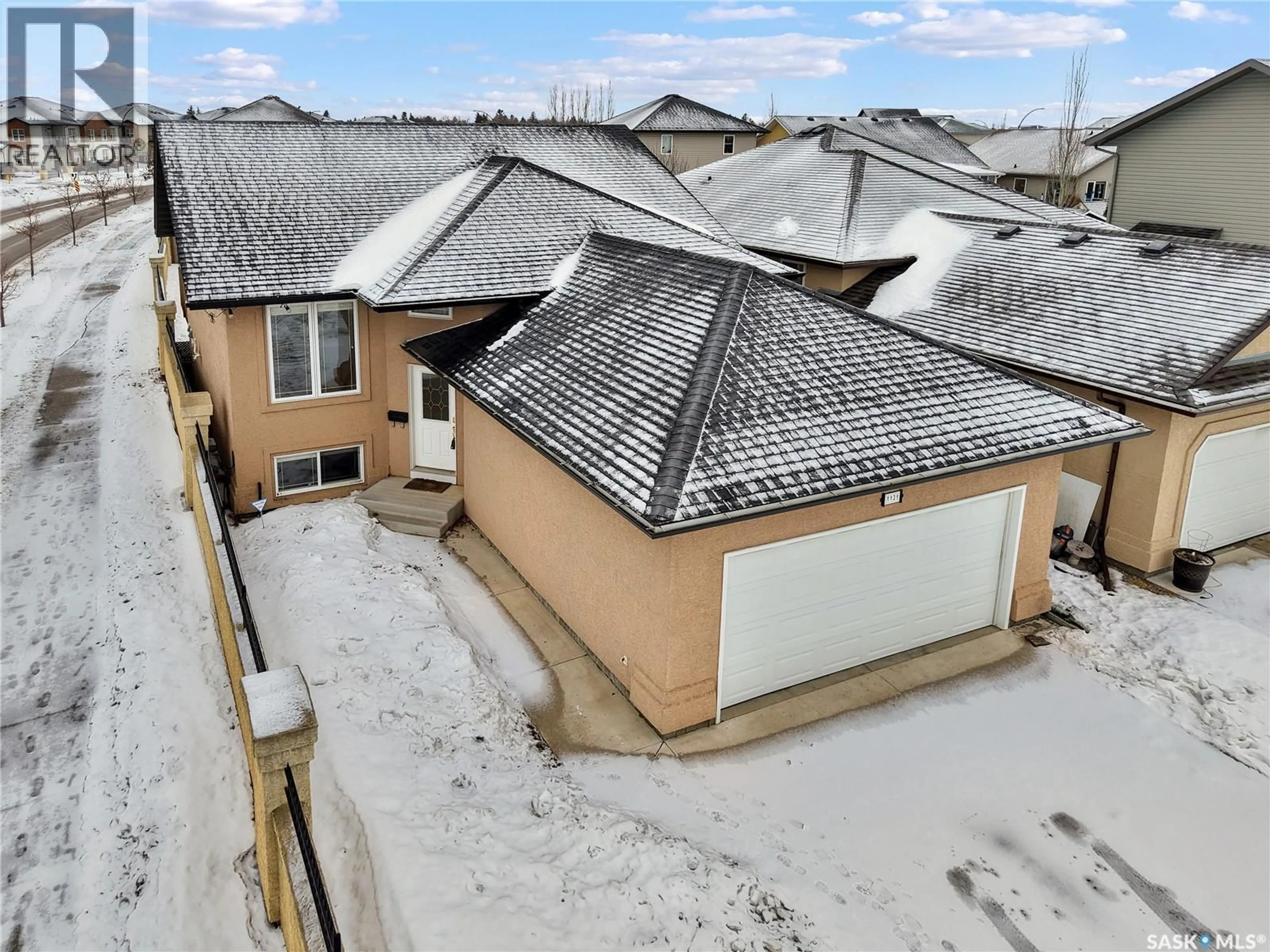 A pic from outside/outdoor area/front of a property/back of a property/a pic from drone, street for 1131 DENHAM RISE, Saskatoon Saskatchewan S7R0B2