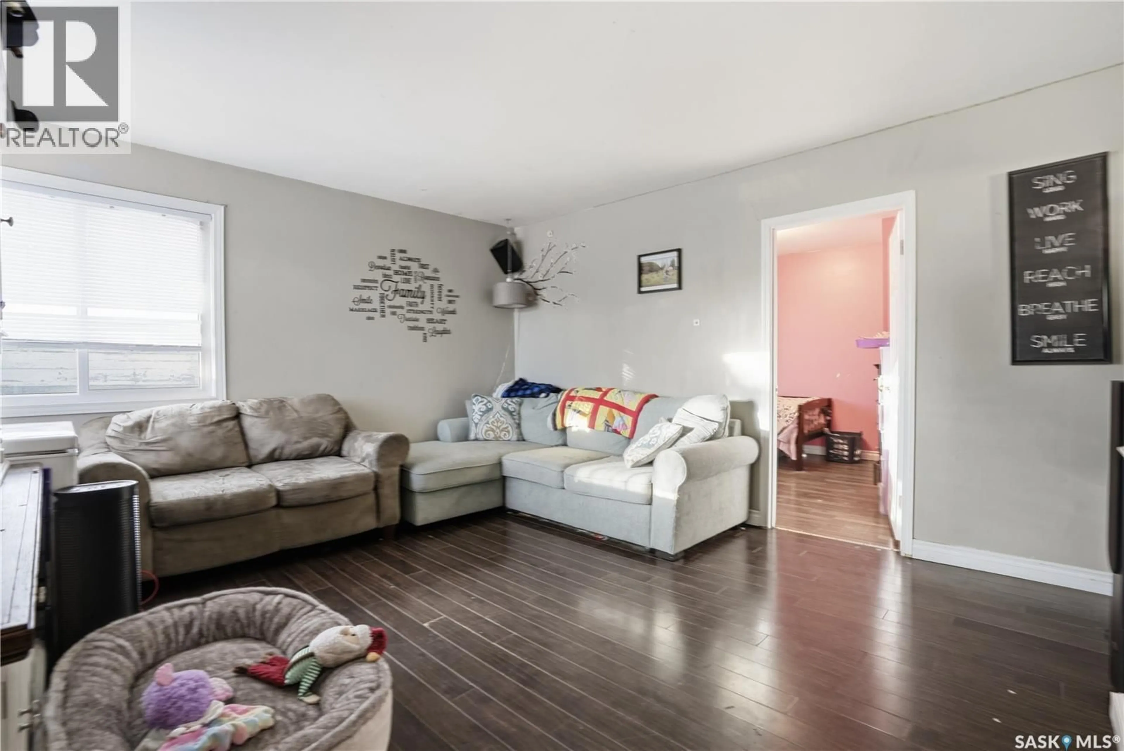 Living room with furniture, wood/laminate floor for 118 OTTAWA STREET, Regina Saskatchewan S4R1N2