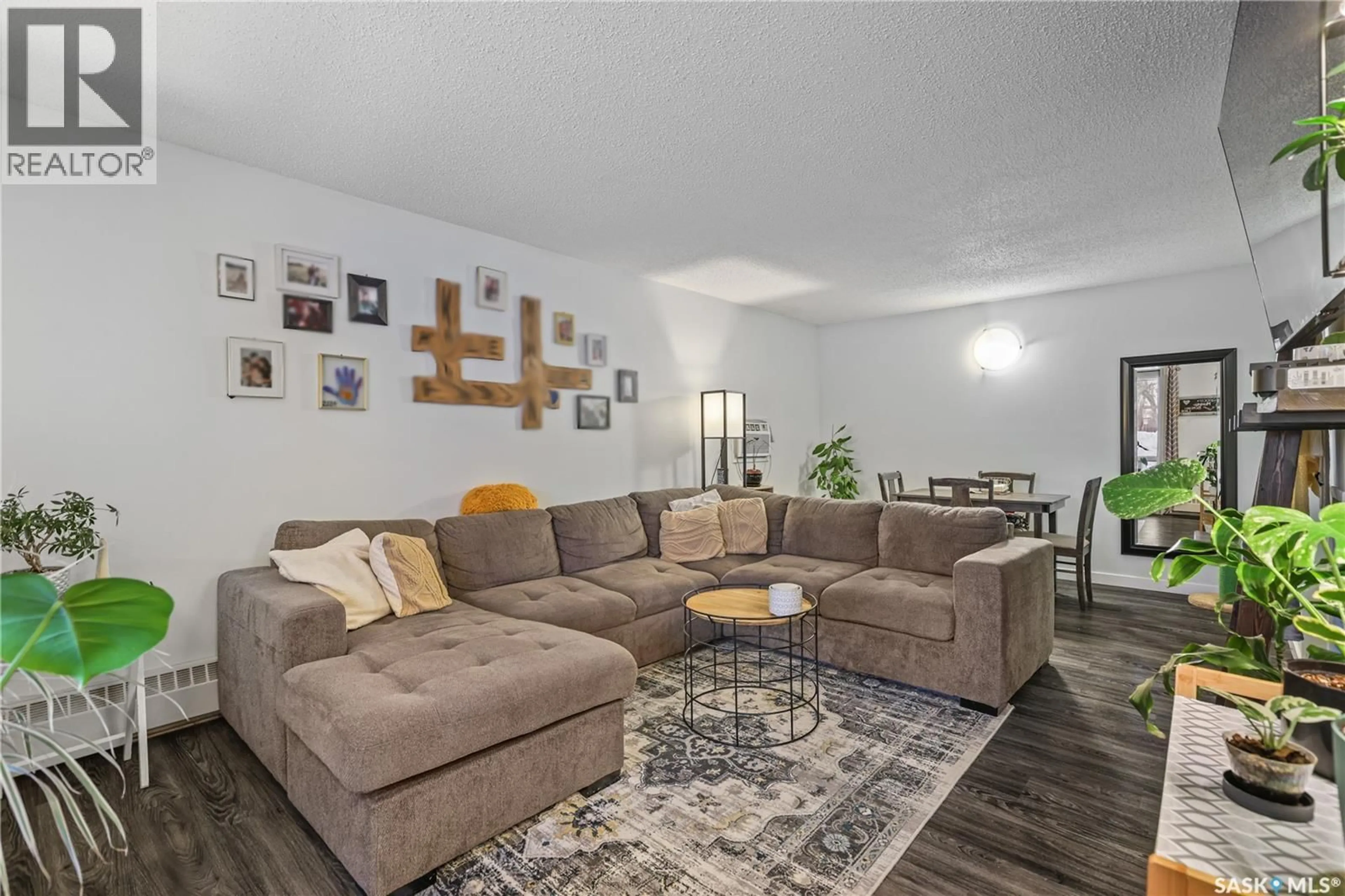Living room with furniture, wood/laminate floor for 67 RODENBUSH DRIVE, Regina Saskatchewan S4R8C7