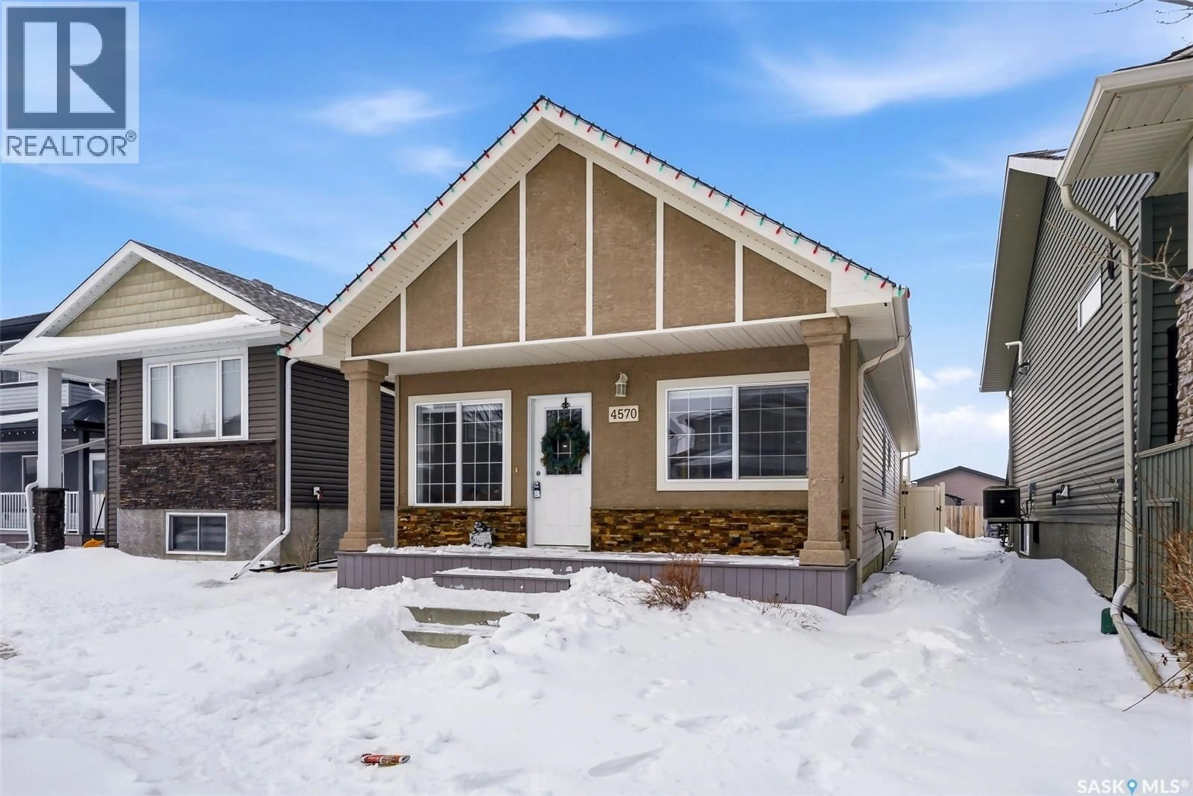 Home with vinyl exterior material, street for 4570 JAMES HILL ROAD, Regina Saskatchewan S4W0K8