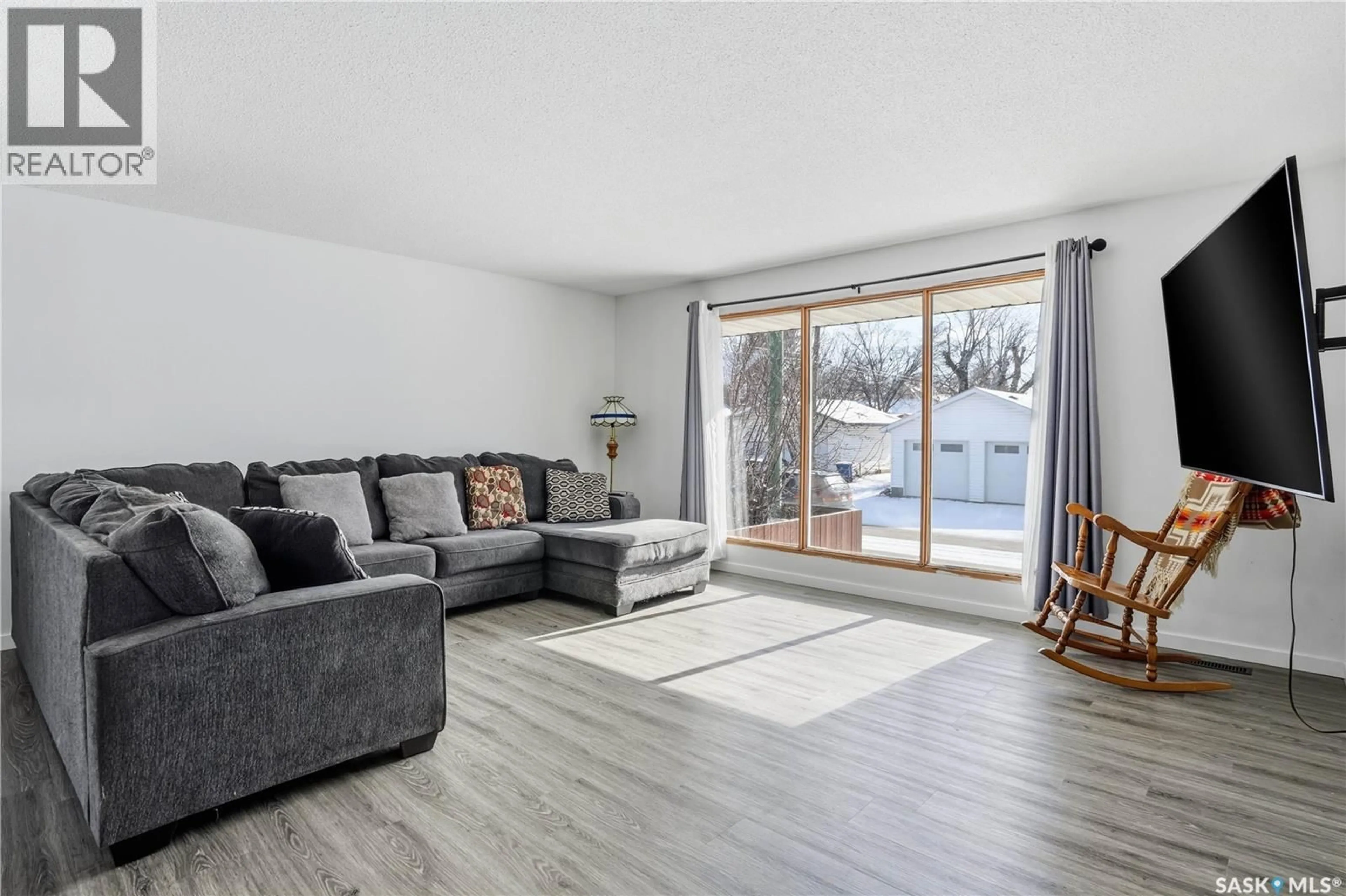 Living room with furniture, wood/laminate floor for 180 SASKATCHEWAN STREET, Moose Jaw Saskatchewan S6H6L8