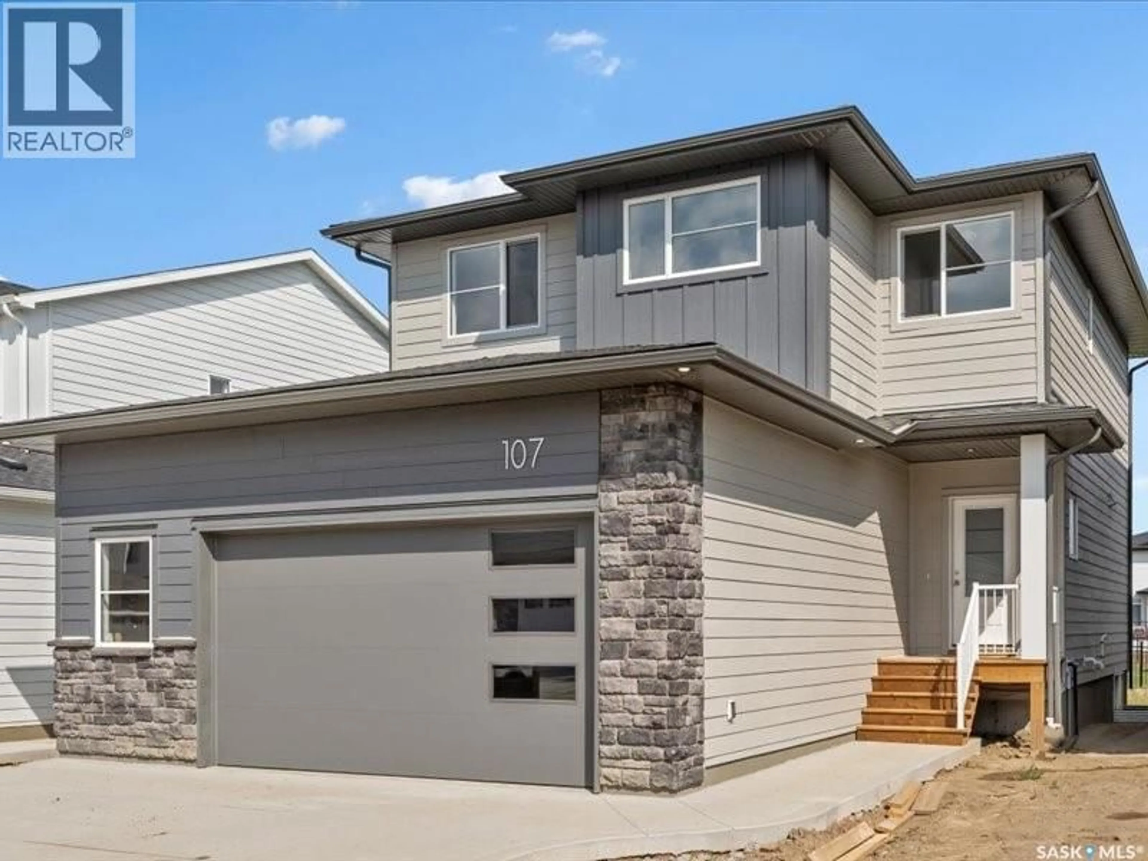 Home with vinyl exterior material, street for 107 KATZ AVENUE, Saskatoon Saskatchewan S7V1S9