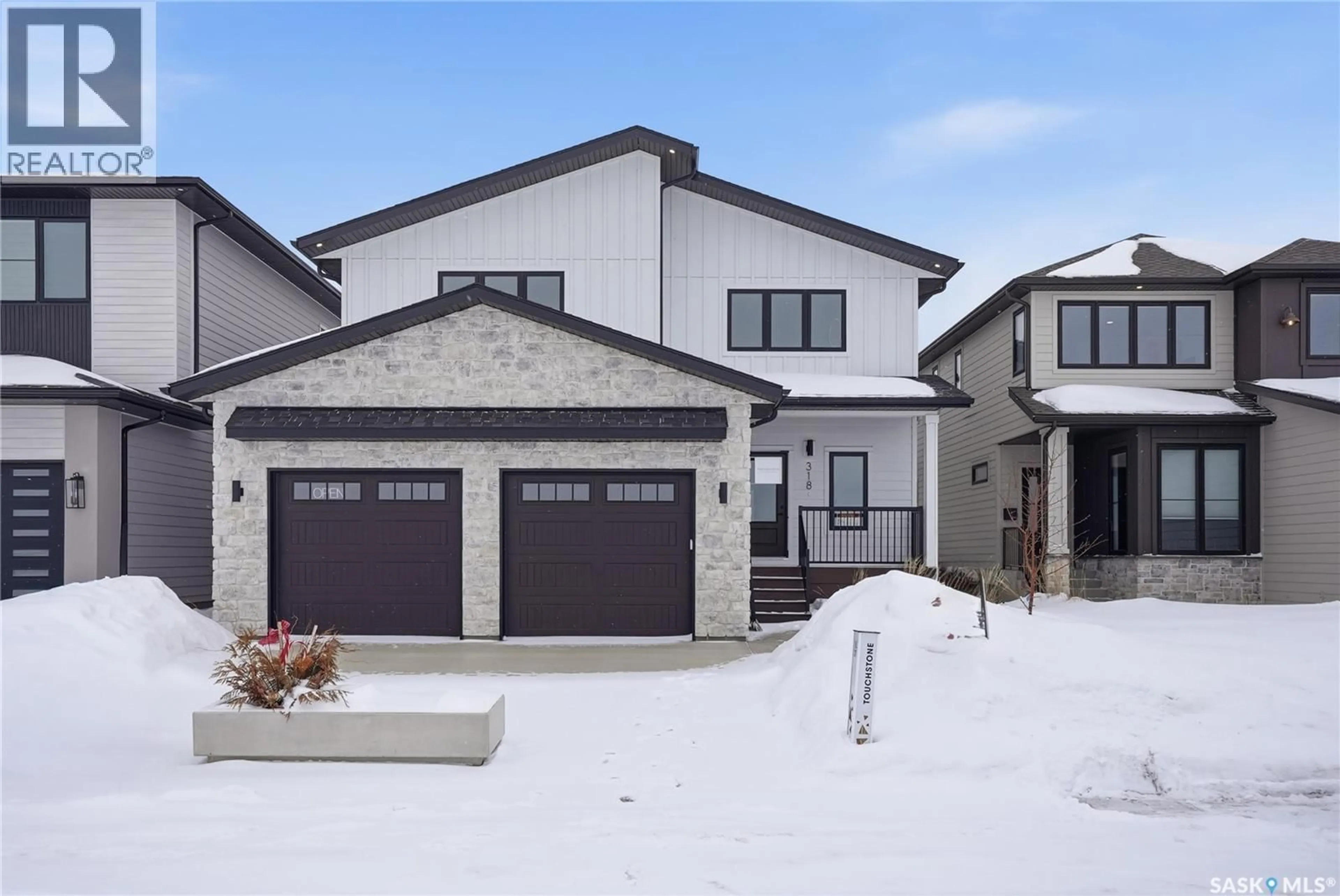 Home with brick exterior material, street for 318 TAUBE GREEN, Saskatoon Saskatchewan S7V1M4