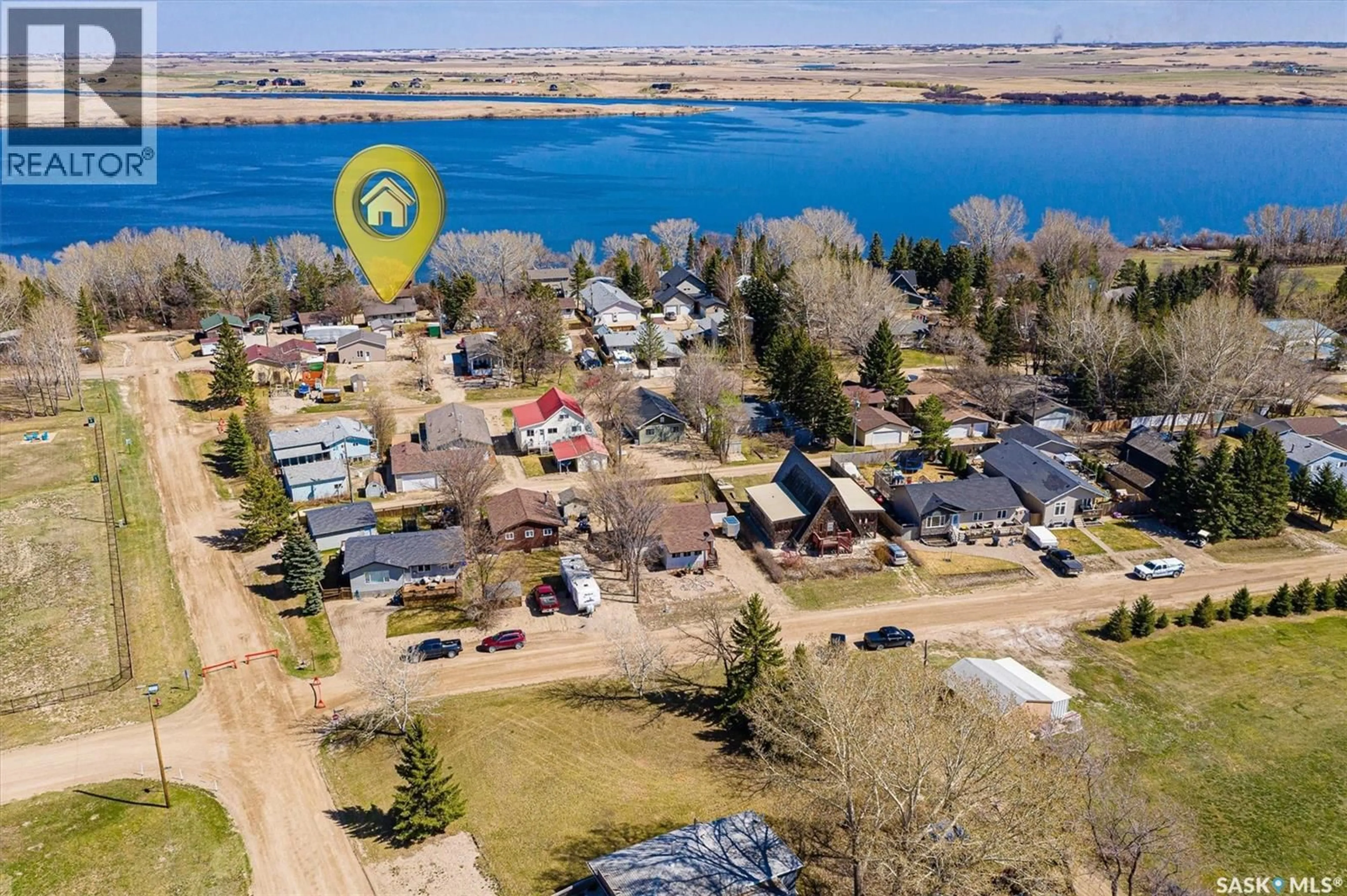 A pic from outside/outdoor area/front of a property/back of a property/a pic from drone, water/lake/river/ocean view for 48 PROCTER DRIVE, Shields Saskatchewan S7C0A1