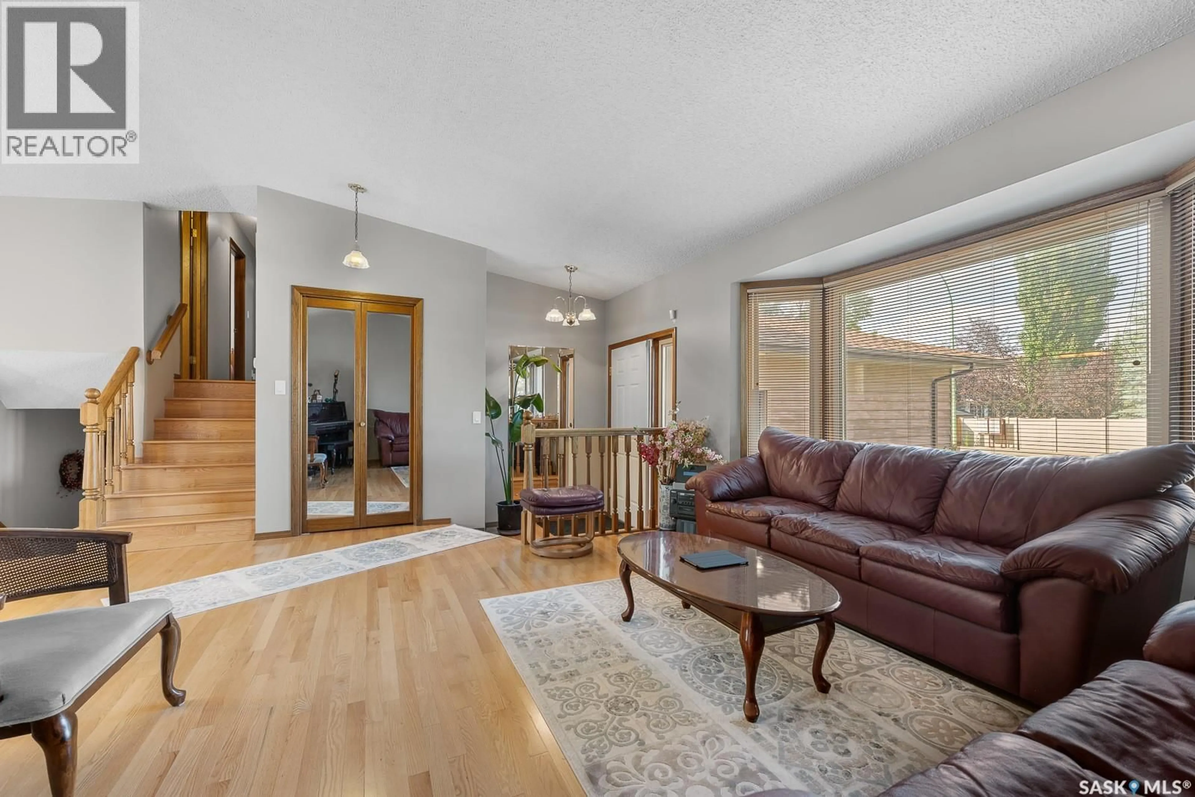 Living room with furniture, wood/laminate floor for 3506 EDINBURGH DRIVE, Regina Saskatchewan S4V2H6