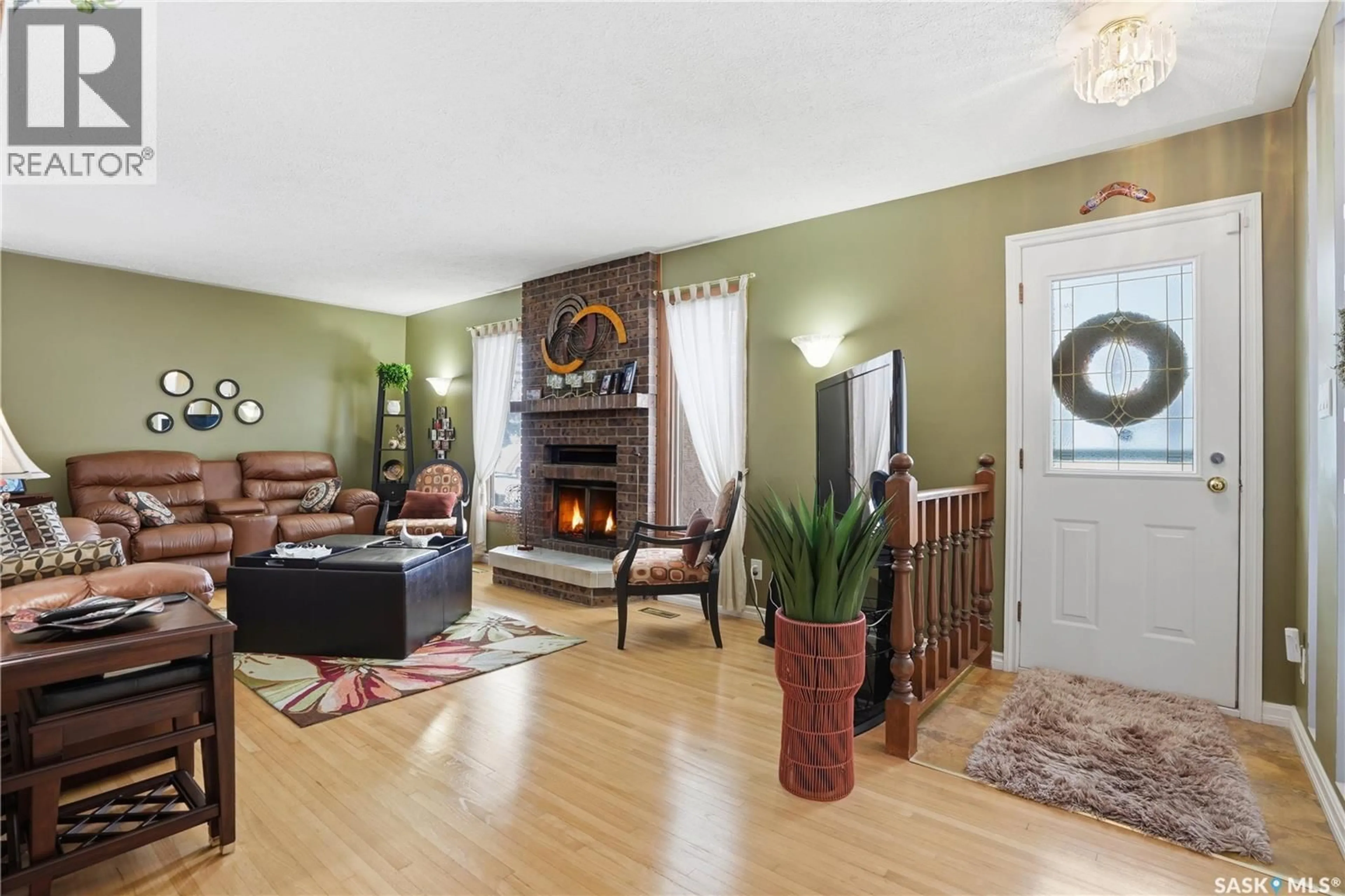 Living room with furniture, wood/laminate floor for 1922 8TH AVENUE, Regina Saskatchewan S4R0G6