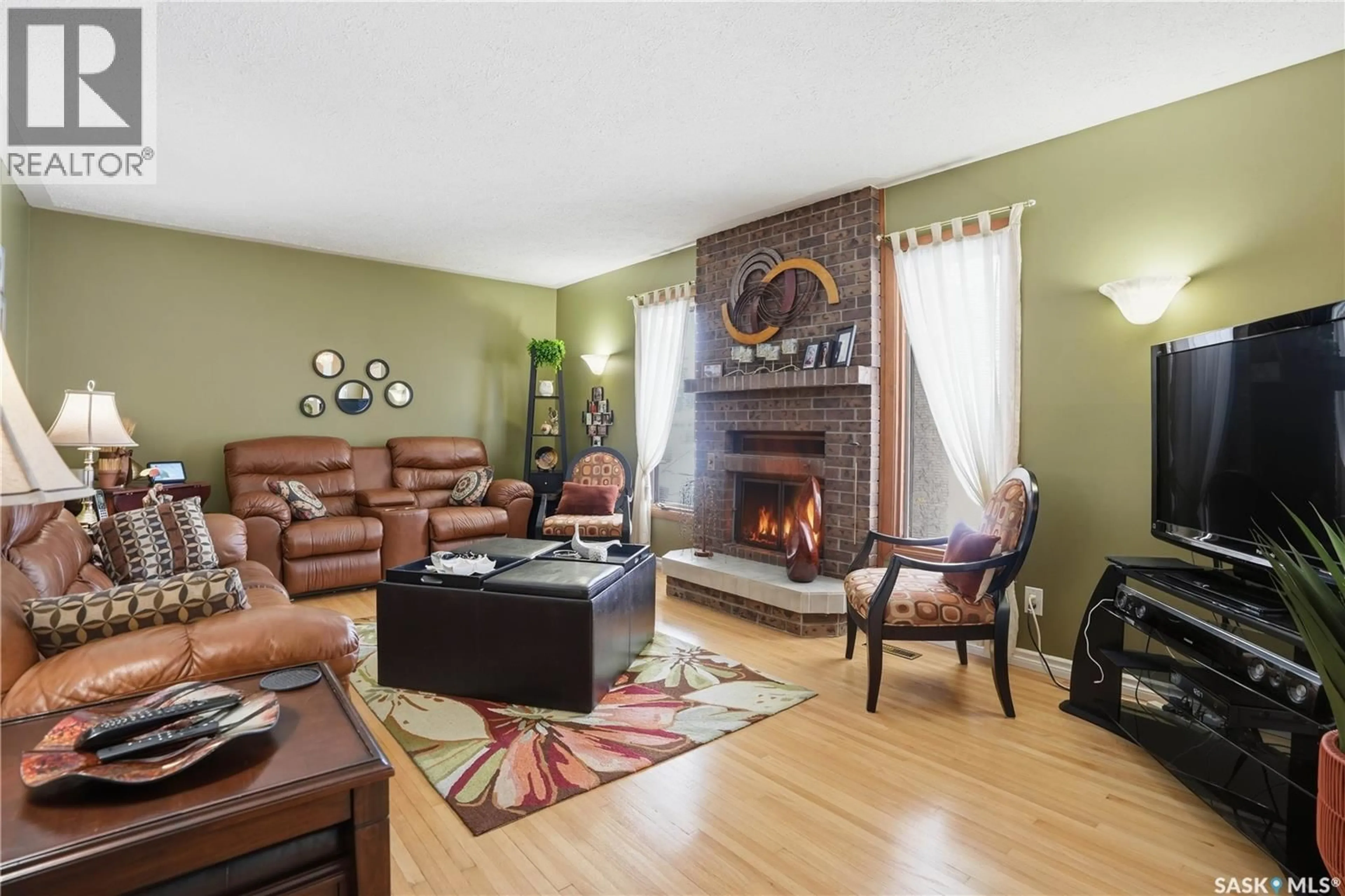 Living room with furniture, wood/laminate floor for 1922 8TH AVENUE, Regina Saskatchewan S4R0G6