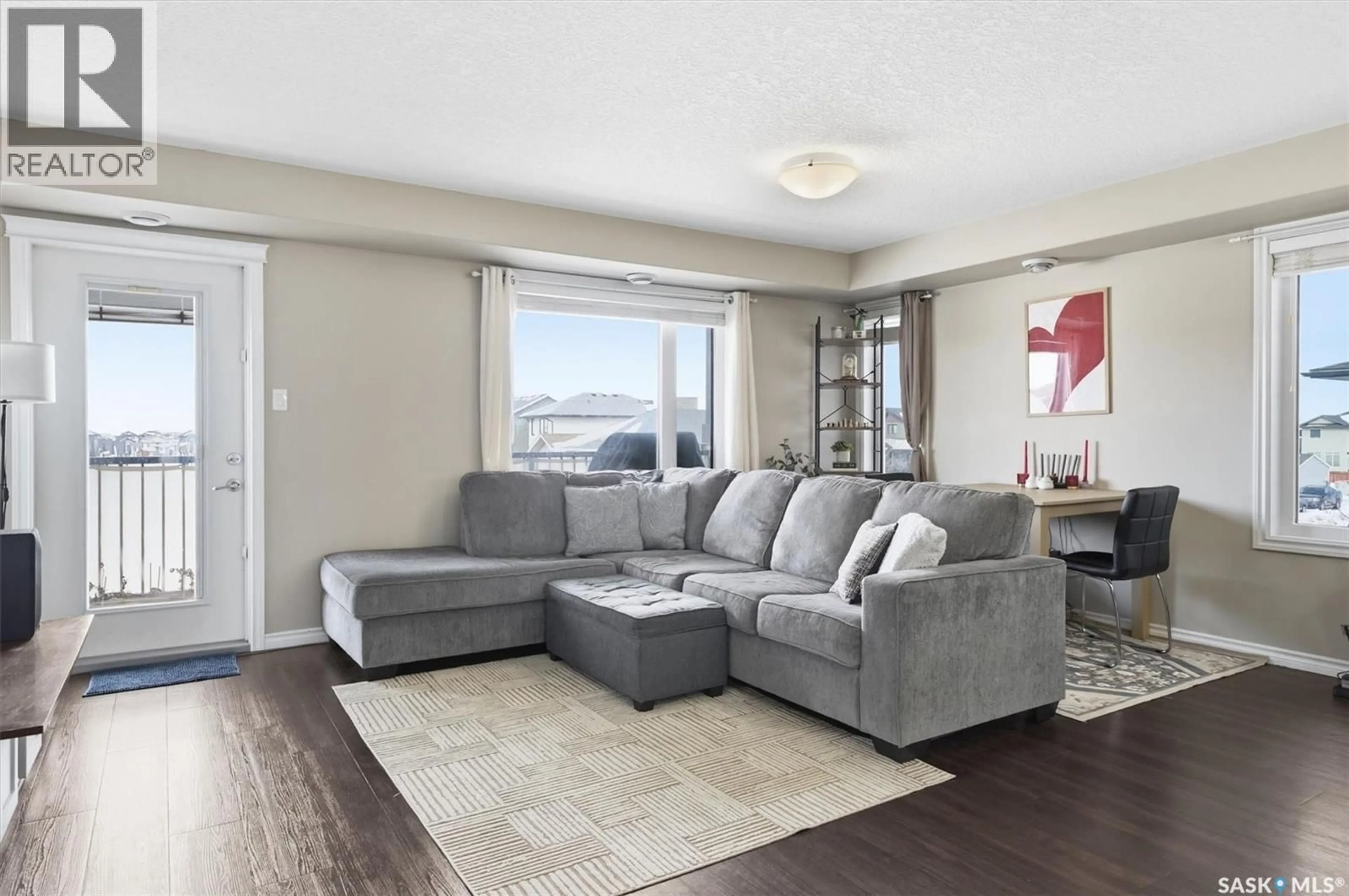 Living room with furniture, unknown for 210 - 213 RAJPUT WAY, Saskatoon Saskatchewan S7W0V7