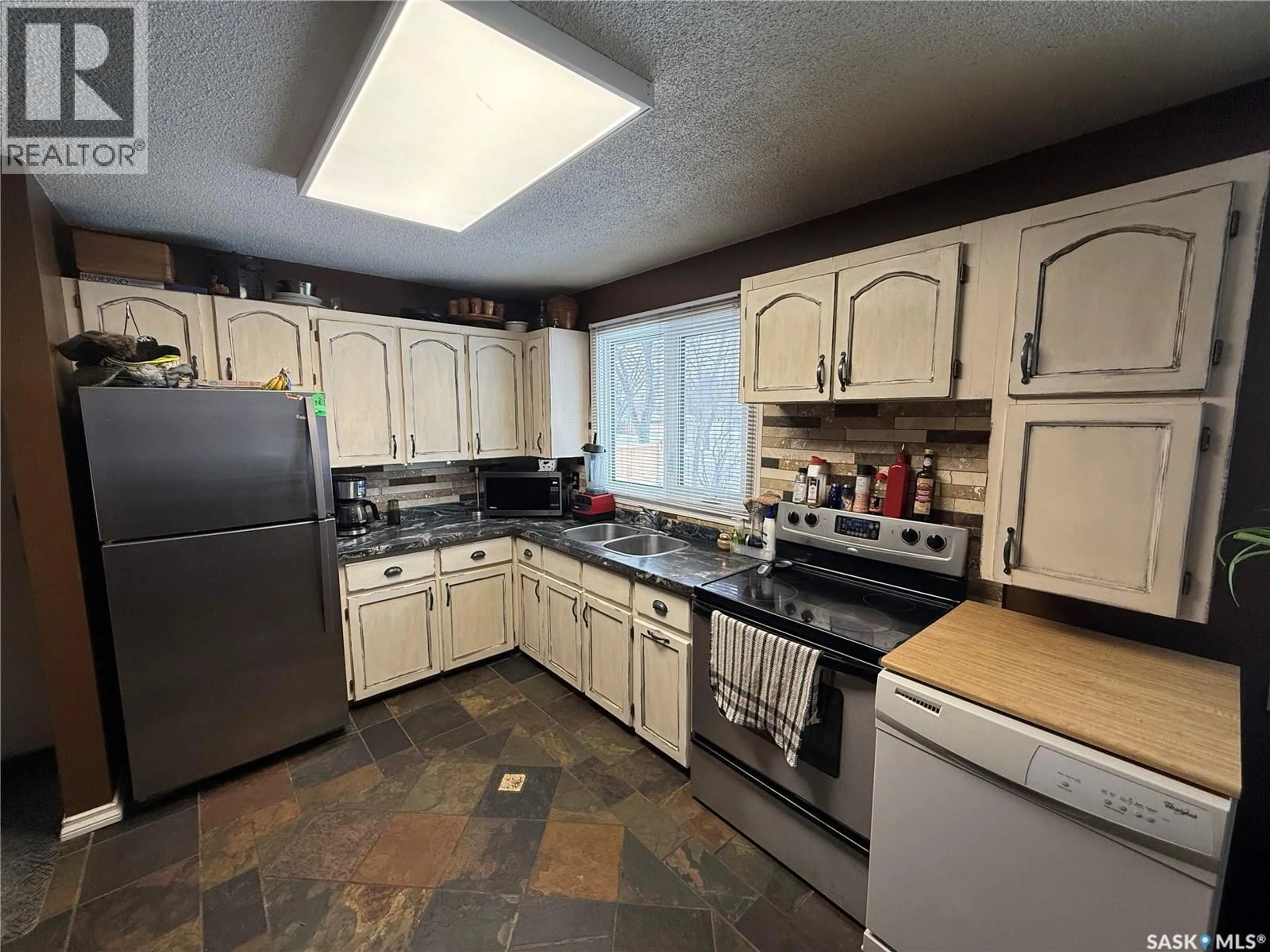 Standard kitchen, ceramic/tile floor for 708 BRIMACOMBE DRIVE, Weyburn Saskatchewan S4H2P8