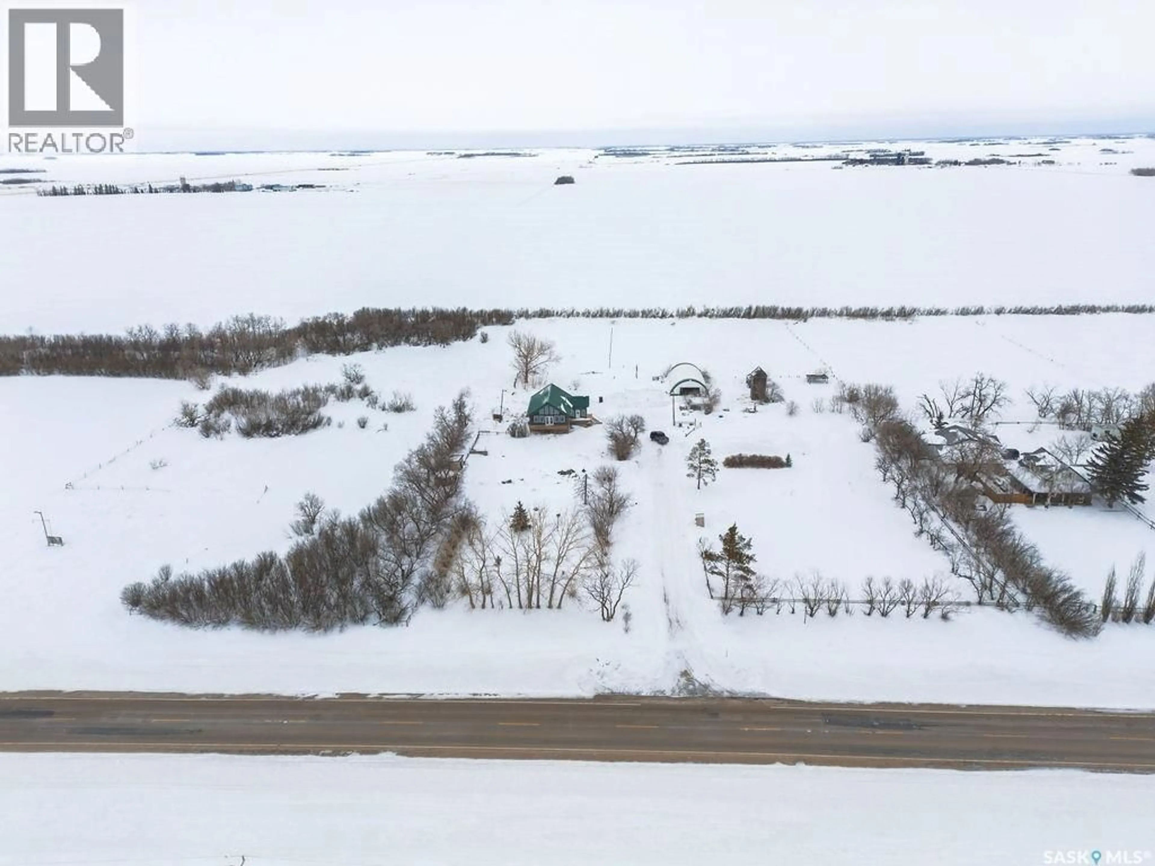 A pic from outside/outdoor area/front of a property/back of a property/a pic from drone, building for 312 ACREAGE, Rosthern Rm No. 403 Saskatchewan S0K4O3