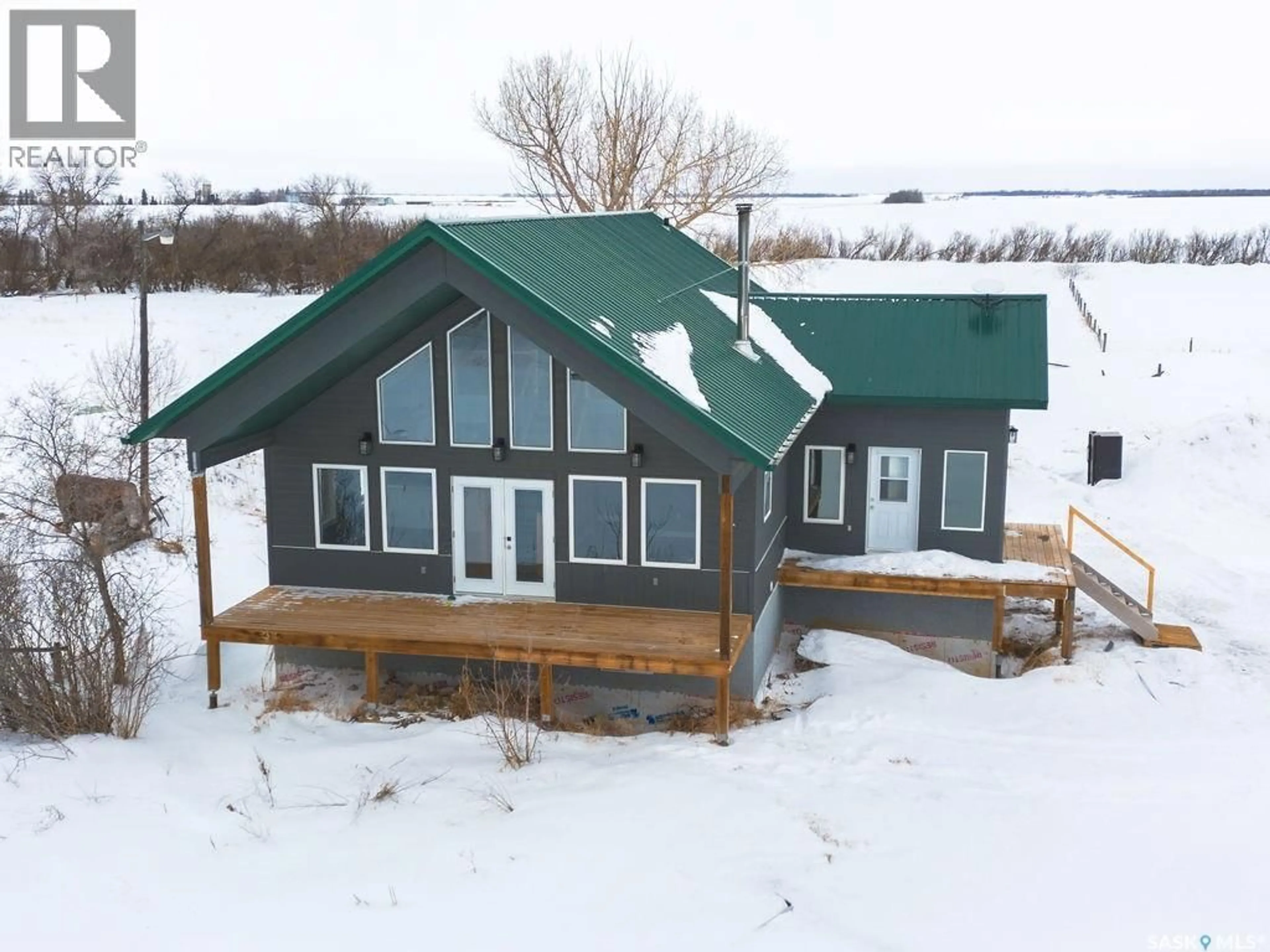 A pic from outside/outdoor area/front of a property/back of a property/a pic from drone, building for 312 ACREAGE, Rosthern Rm No. 403 Saskatchewan S0K4O3
