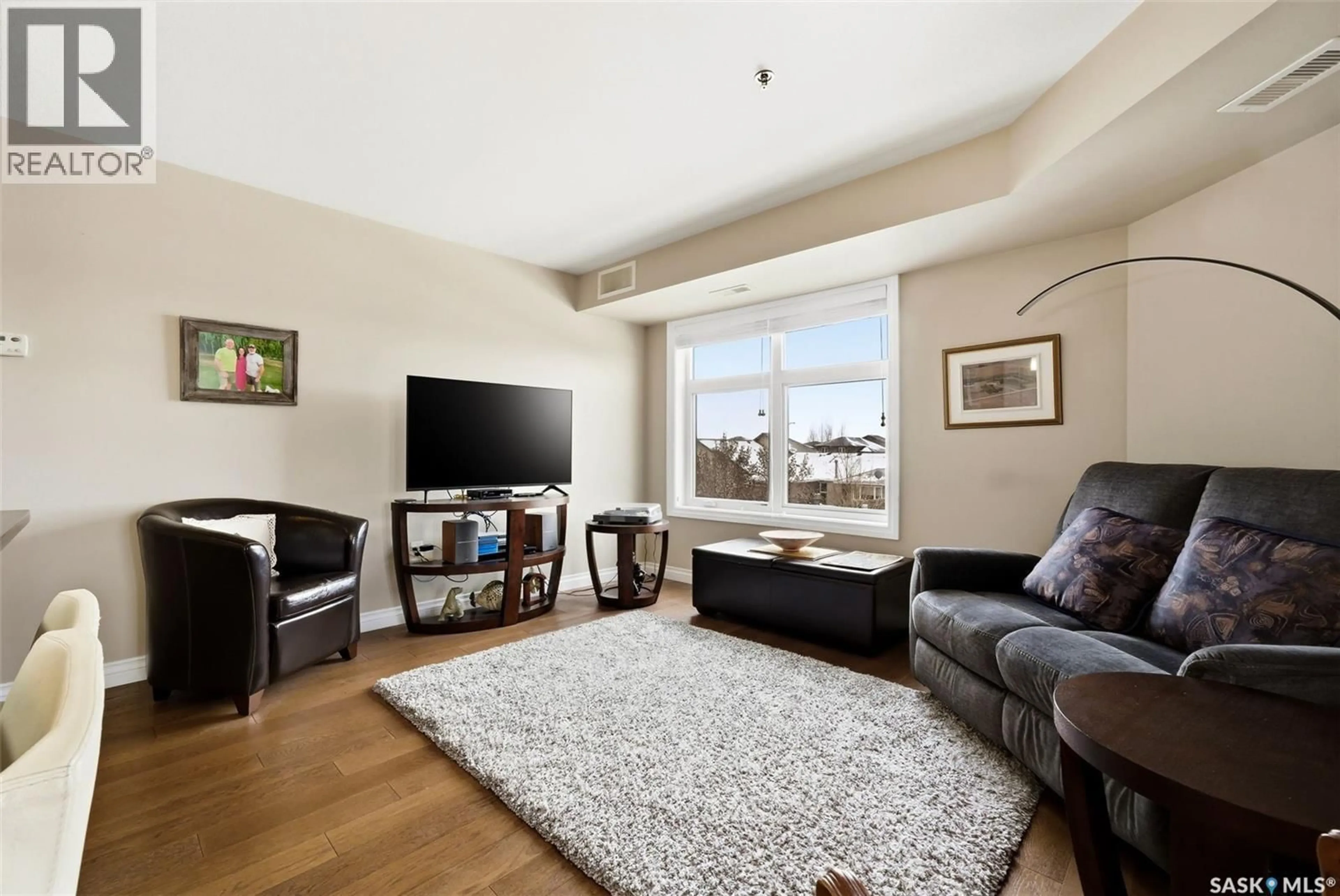 Living room with furniture, unknown for E - 214 3630 HAUGHTON ROAD, Regina Saskatchewan S4V1P1