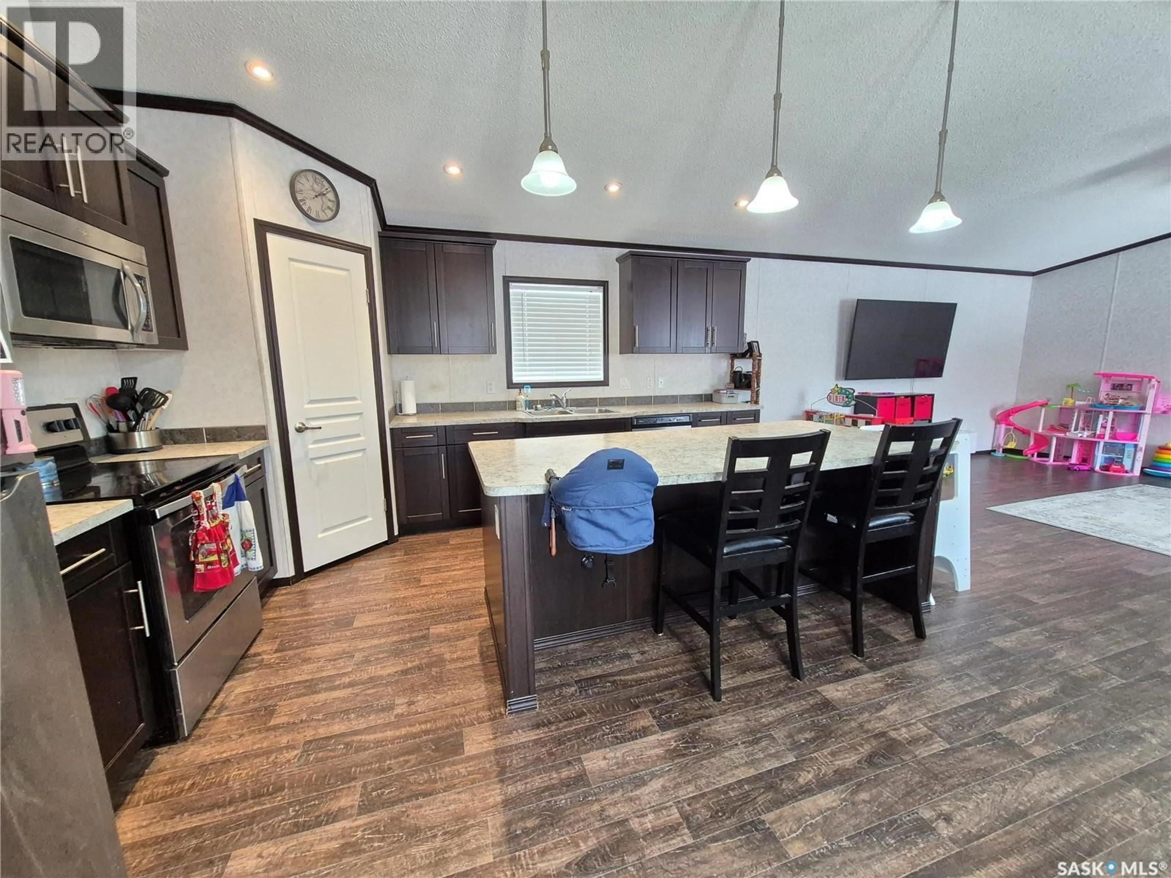 Open concept kitchen, wood/laminate floor for 151 2ND AVENUE, Bengough Saskatchewan S0C0K0