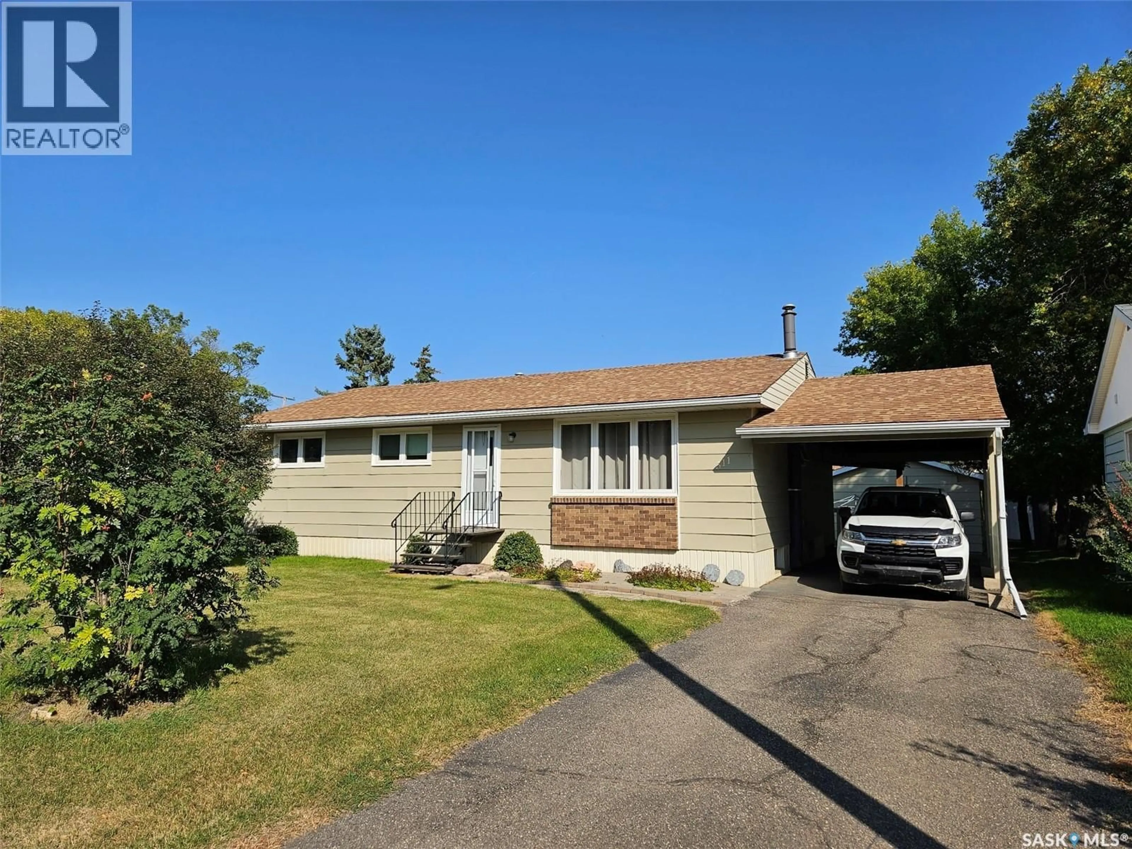 Home with vinyl exterior material, street for 311 6TH STREET, Carlyle Saskatchewan S0C0R0