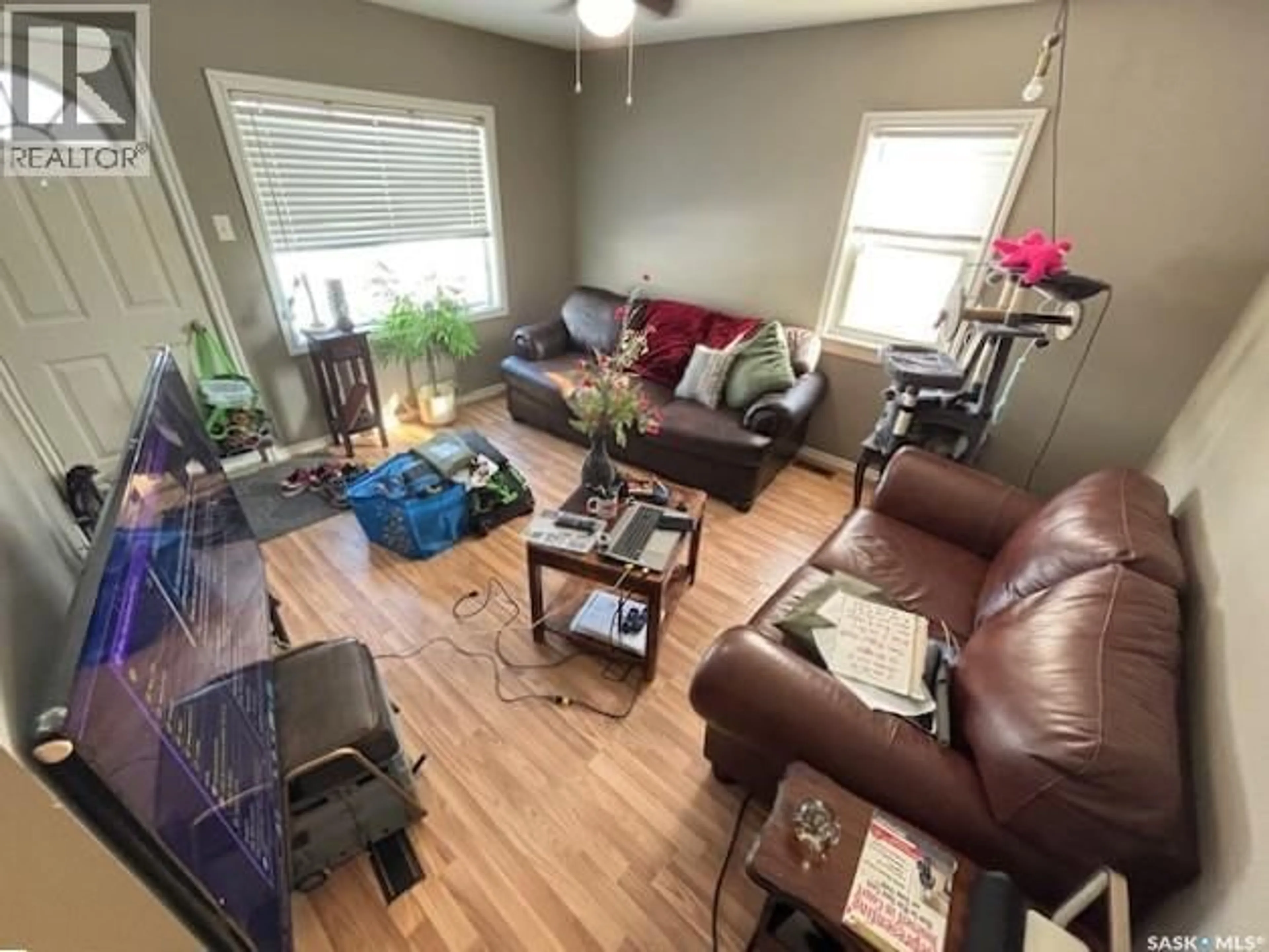 Living room with furniture, wood/laminate floor for 569 OMINICA STREET, Moose Jaw Saskatchewan S6H0H2