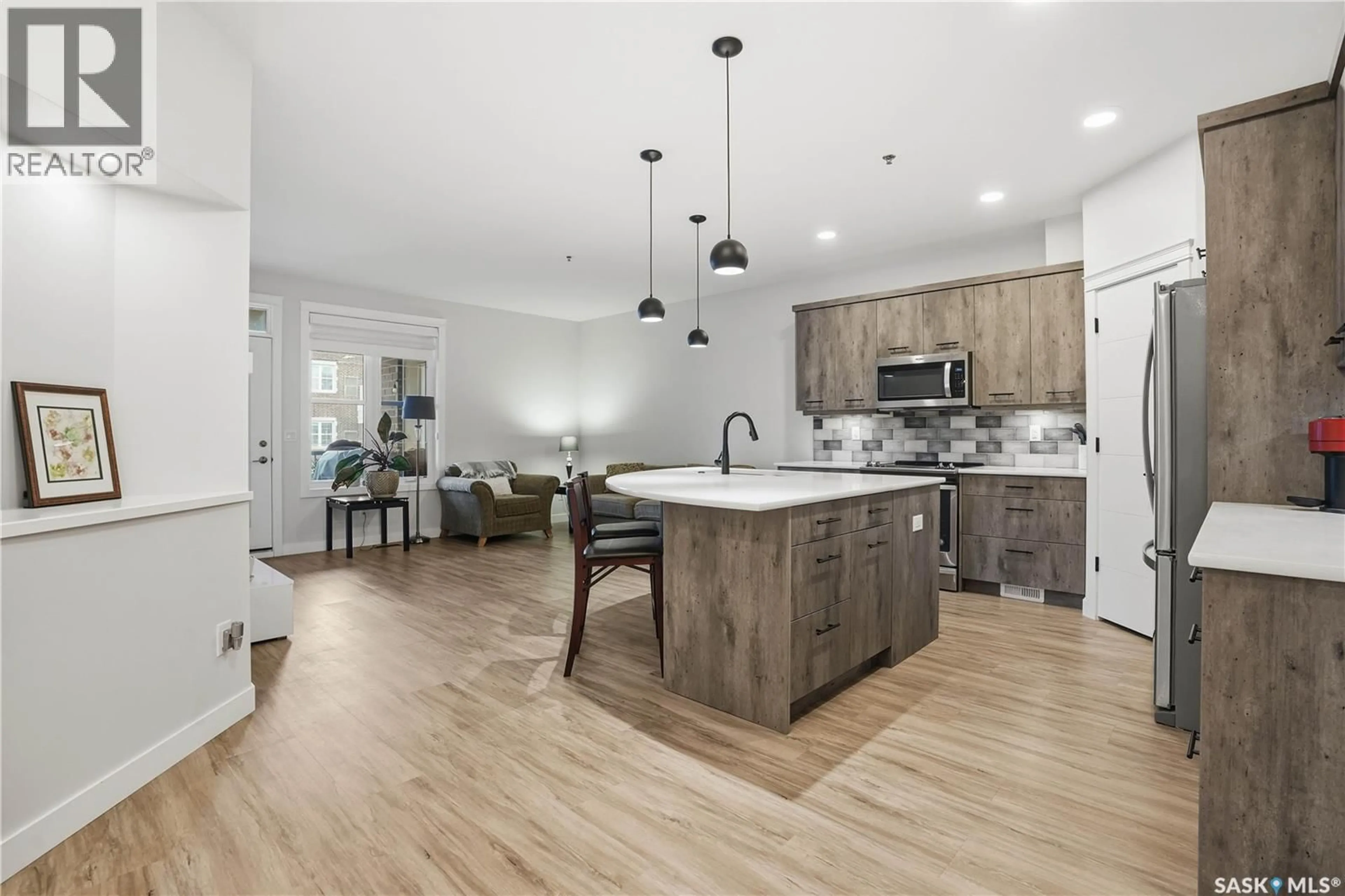 Open concept kitchen, unknown for 213 1700 BADHAM BOULEVARD, Regina Saskatchewan S4P0J7