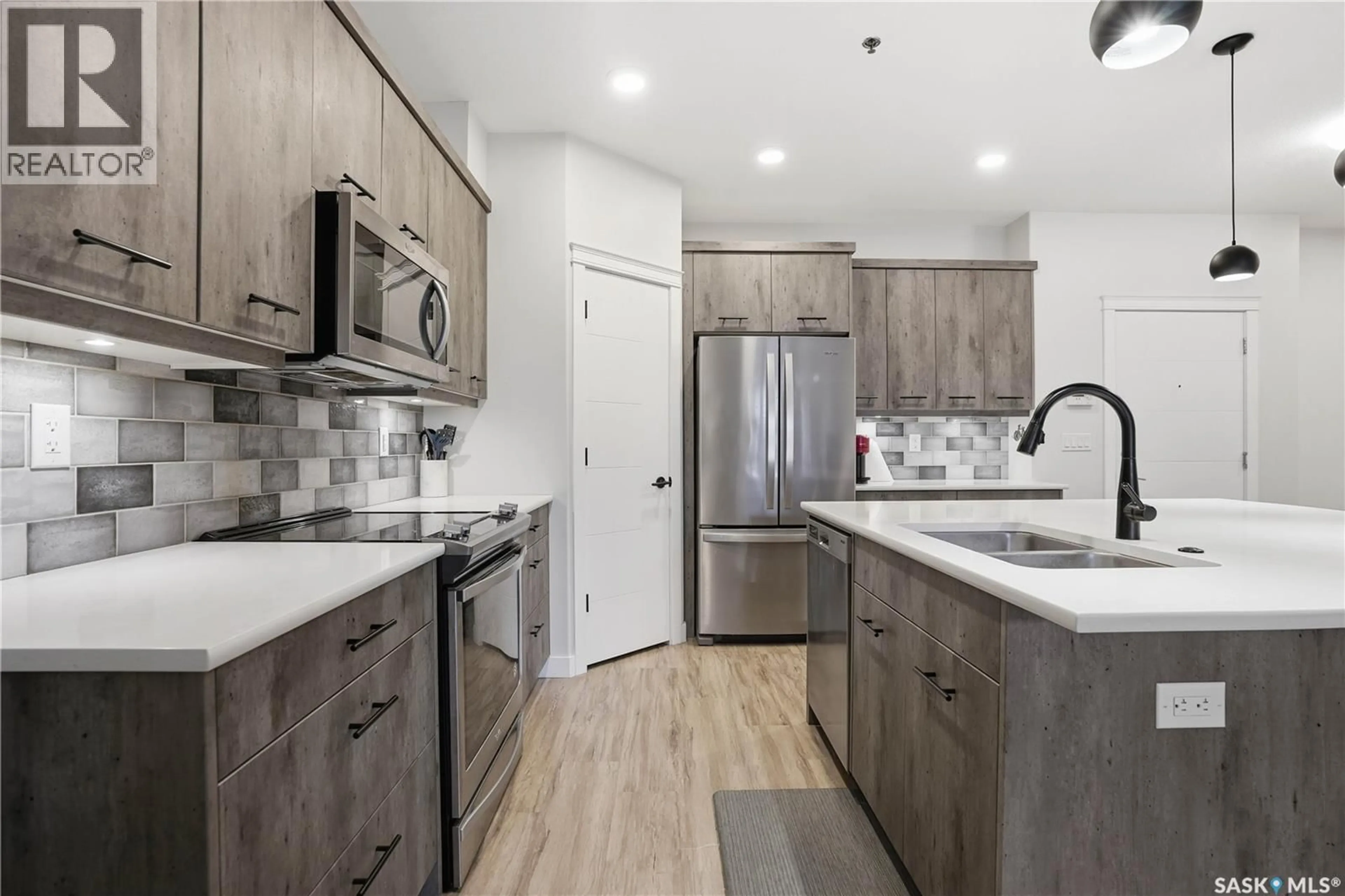 Open concept kitchen, unknown for 213 1700 BADHAM BOULEVARD, Regina Saskatchewan S4P0J7