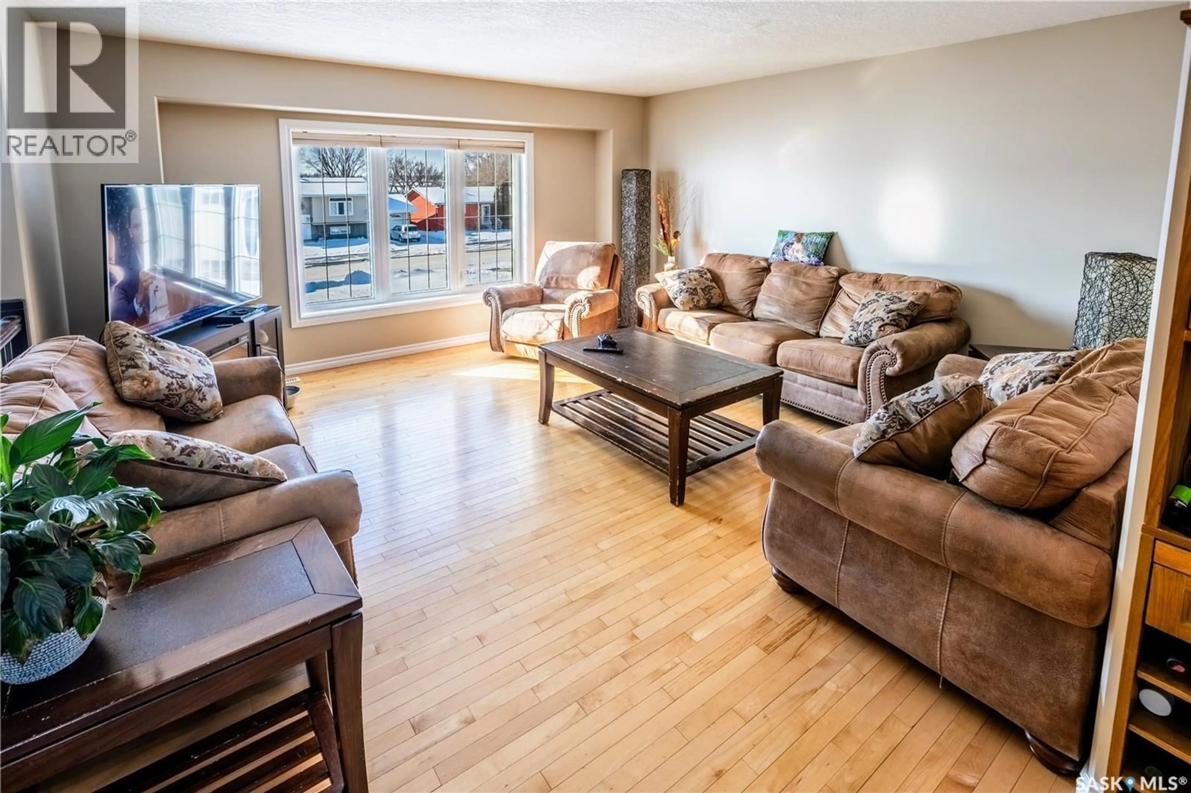 Living room with furniture, wood/laminate floor for 856 ATHABASCA STREET, Moose Jaw Saskatchewan S6H1N7