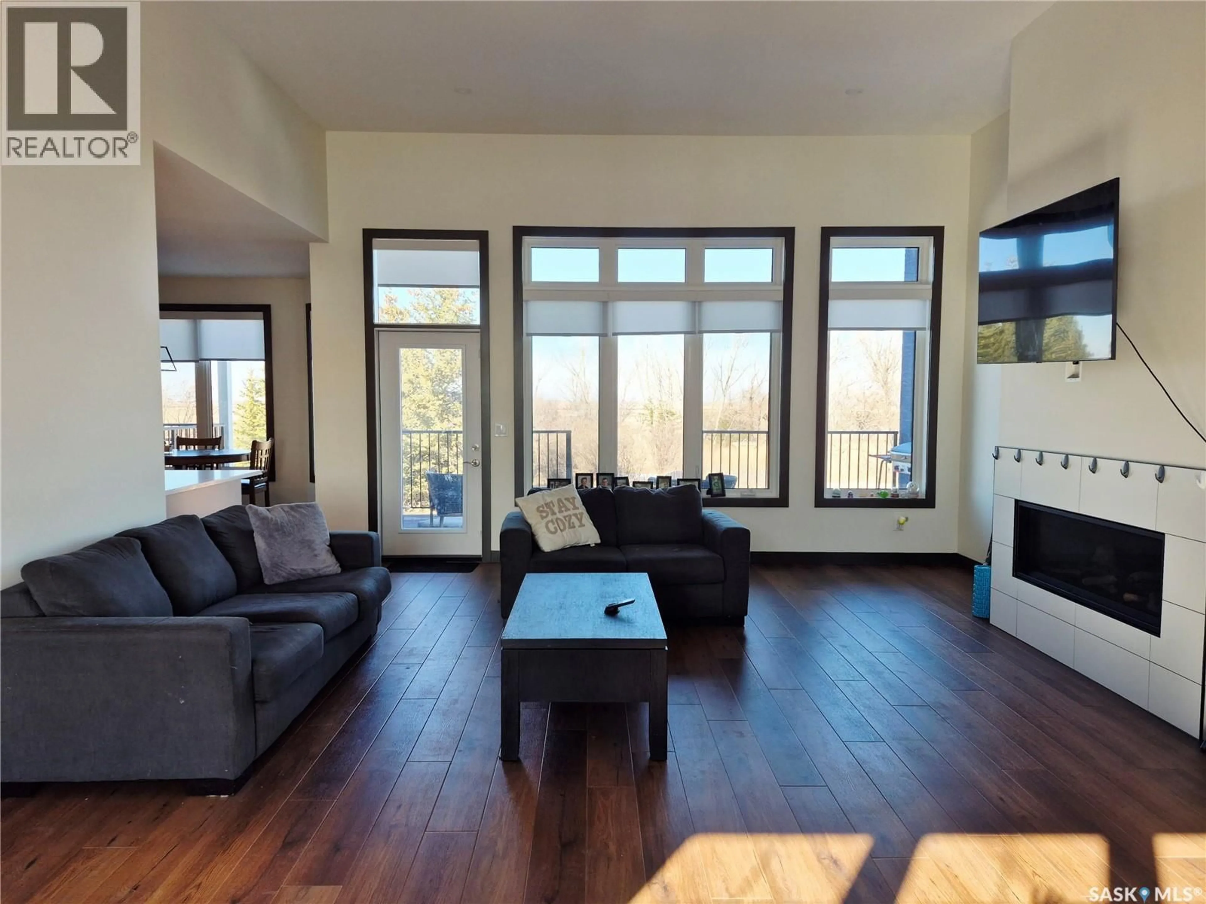 Living room with furniture, wood/laminate floor for SIMPSON ACREAGE, Coulee Rm No. 136 Saskatchewan S9H3X7