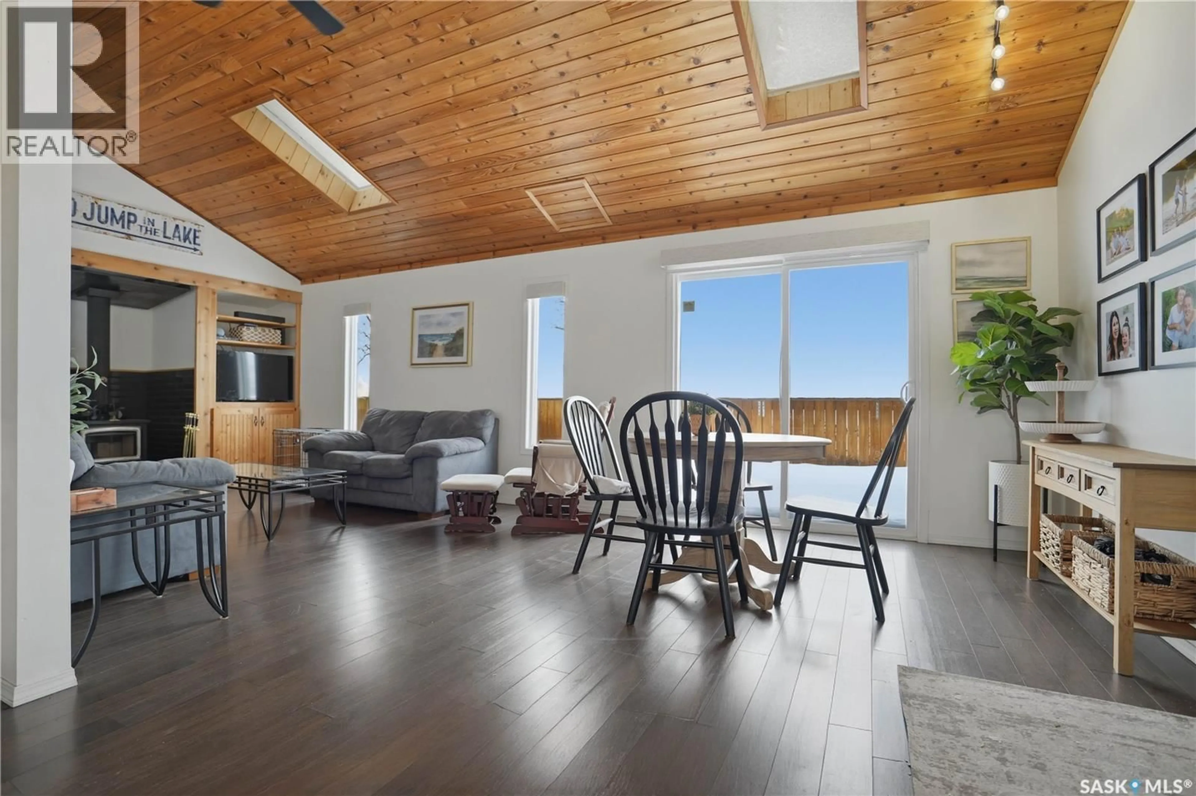 Living room with furniture, wood/laminate floor for 83 LAKEVIEW AVENUE, Meota Rm No.468 Saskatchewan S0M1X0
