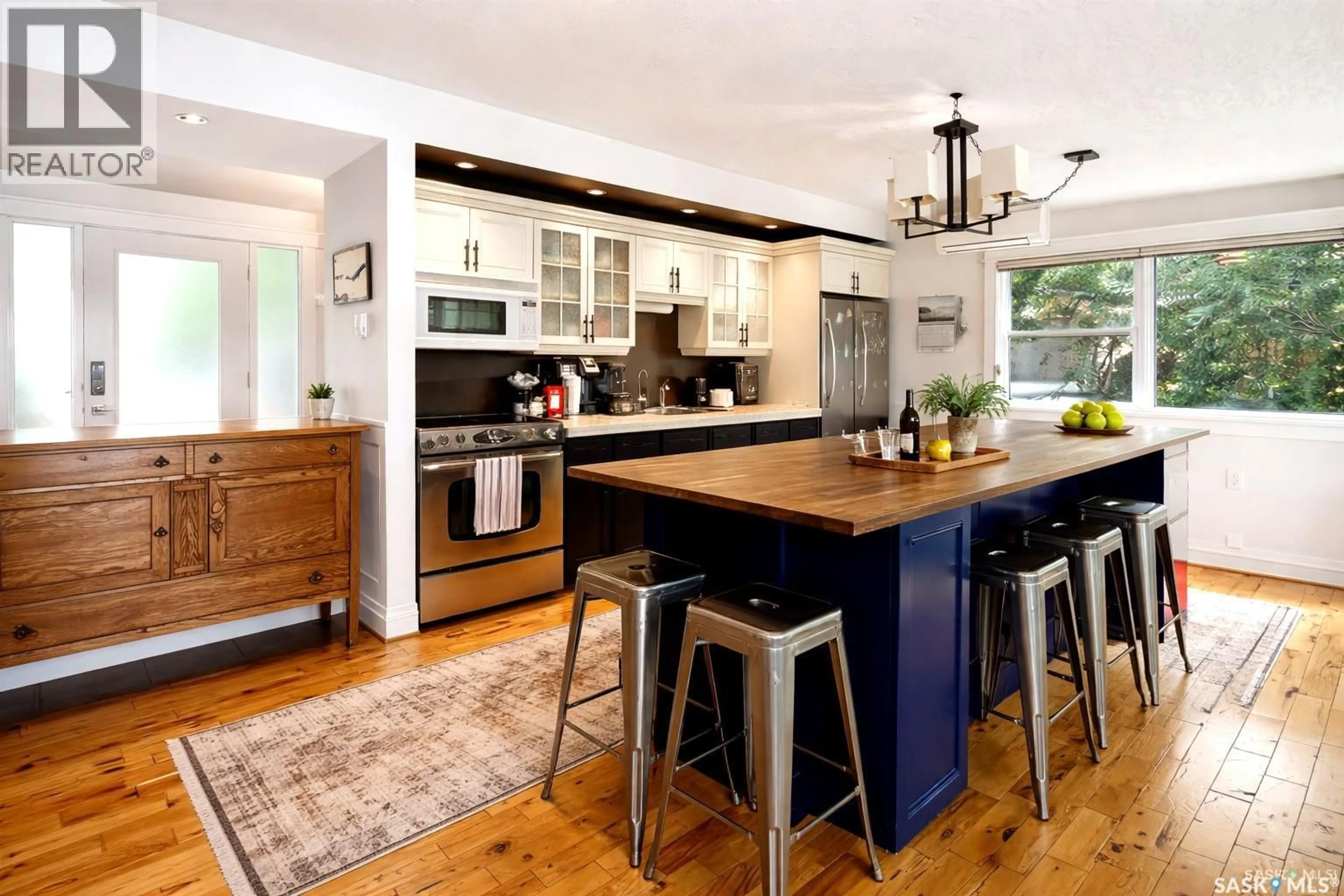 Open concept kitchen, wood/laminate floor for 402 PASQUA LAKE ROAD, North Qu'Appelle Rm No. 187 Saskatchewan S0G1S0