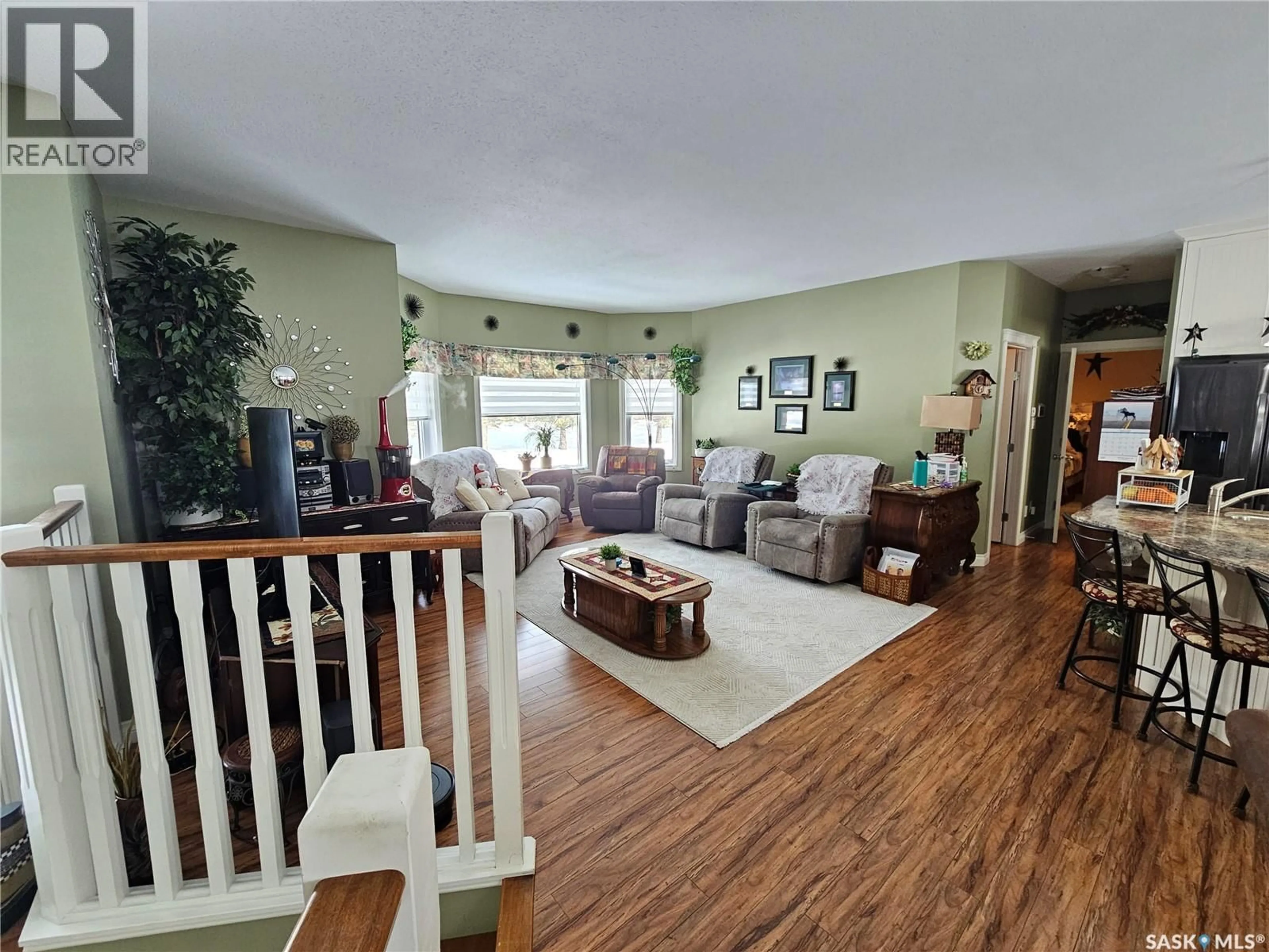 Living room with furniture, wood/laminate floor for 30 ST BONIFACE AVENUE, Goodsoil Saskatchewan S0M1A0