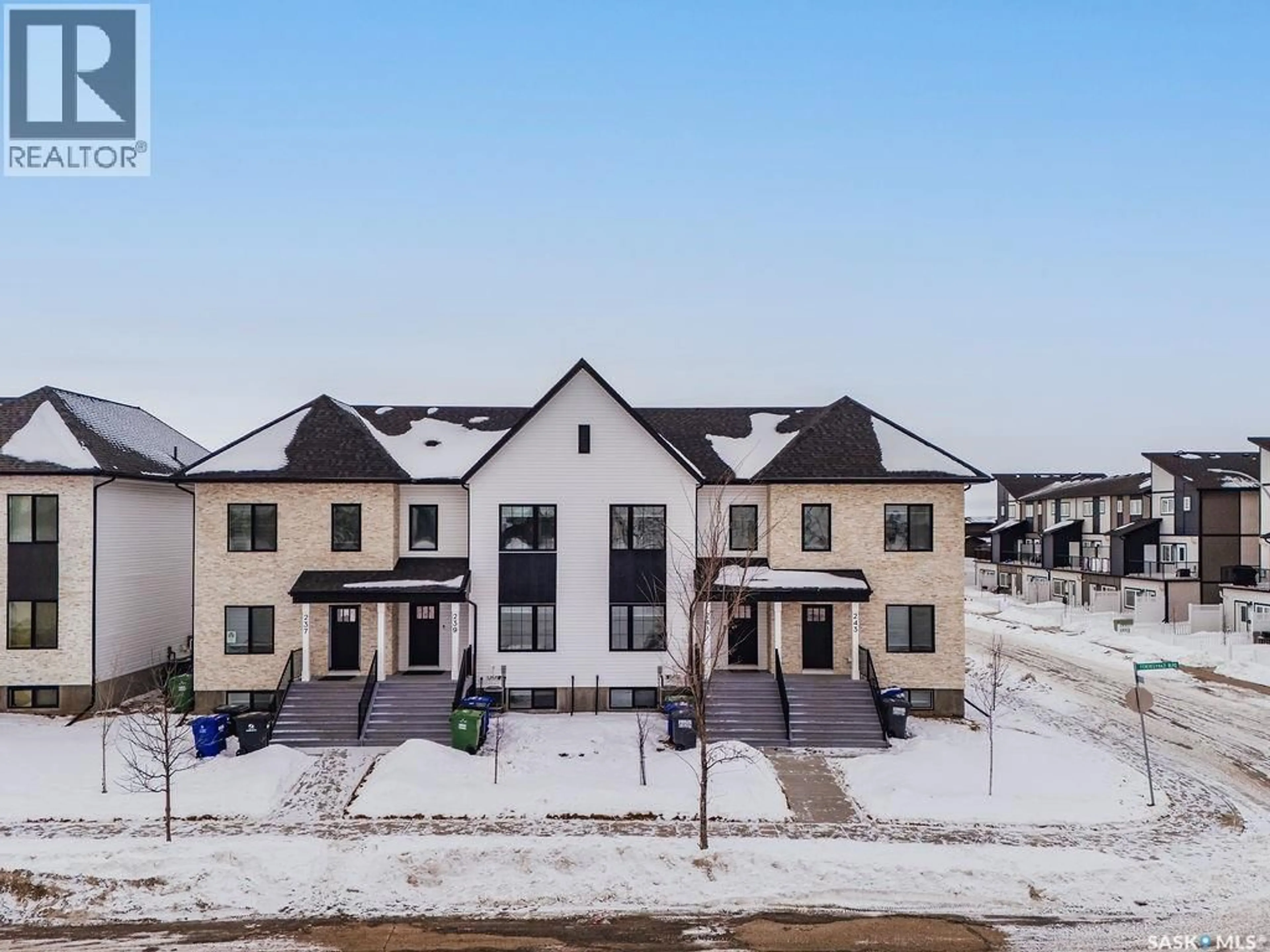 A pic from outside/outdoor area/front of a property/back of a property/a pic from drone, unknown for 241 FEHEREGYHAZI BOULEVARD, Saskatoon Saskatchewan S7W0C2