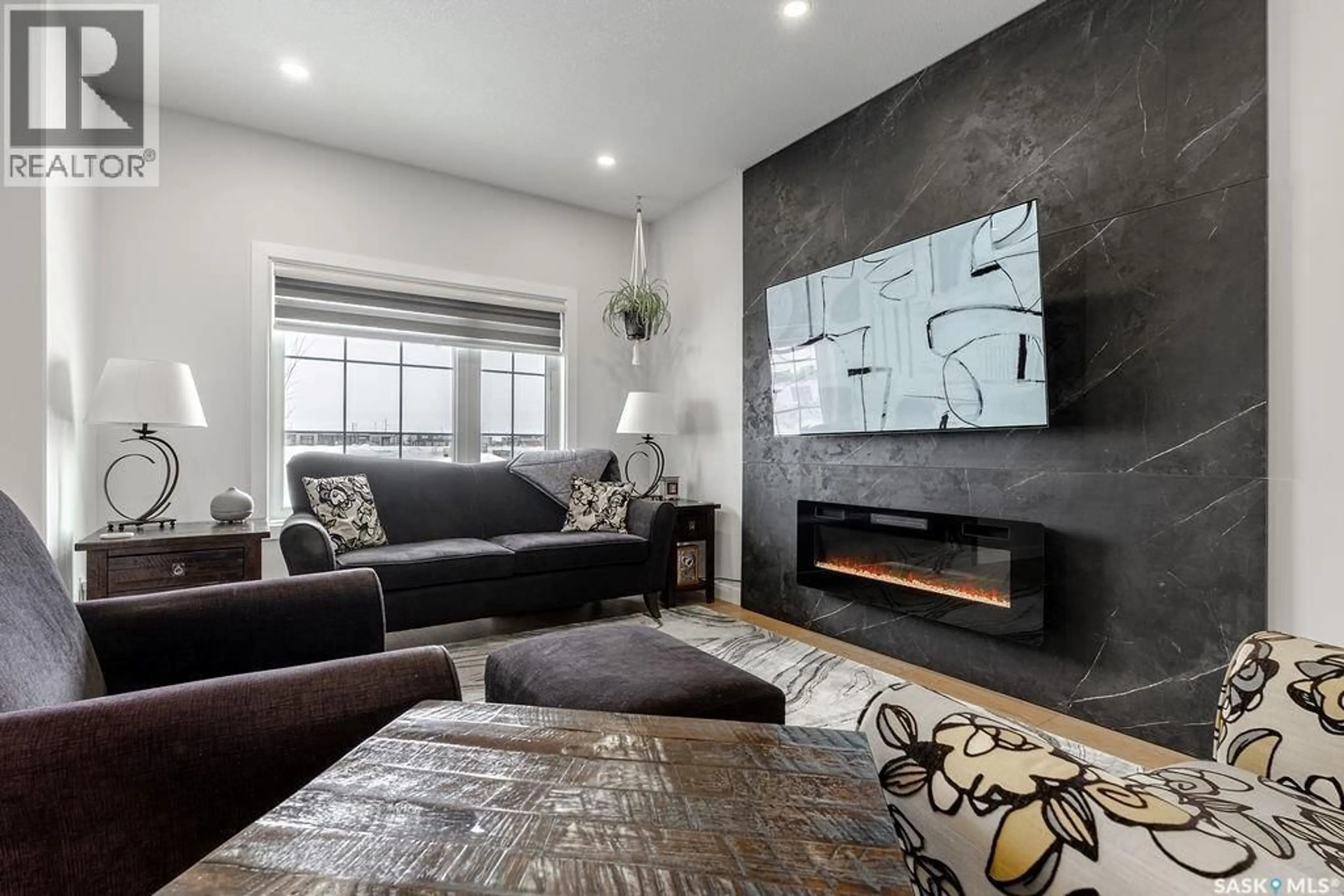 Living room with furniture, cement floor for 241 FEHEREGYHAZI BOULEVARD, Saskatoon Saskatchewan S7W0C2