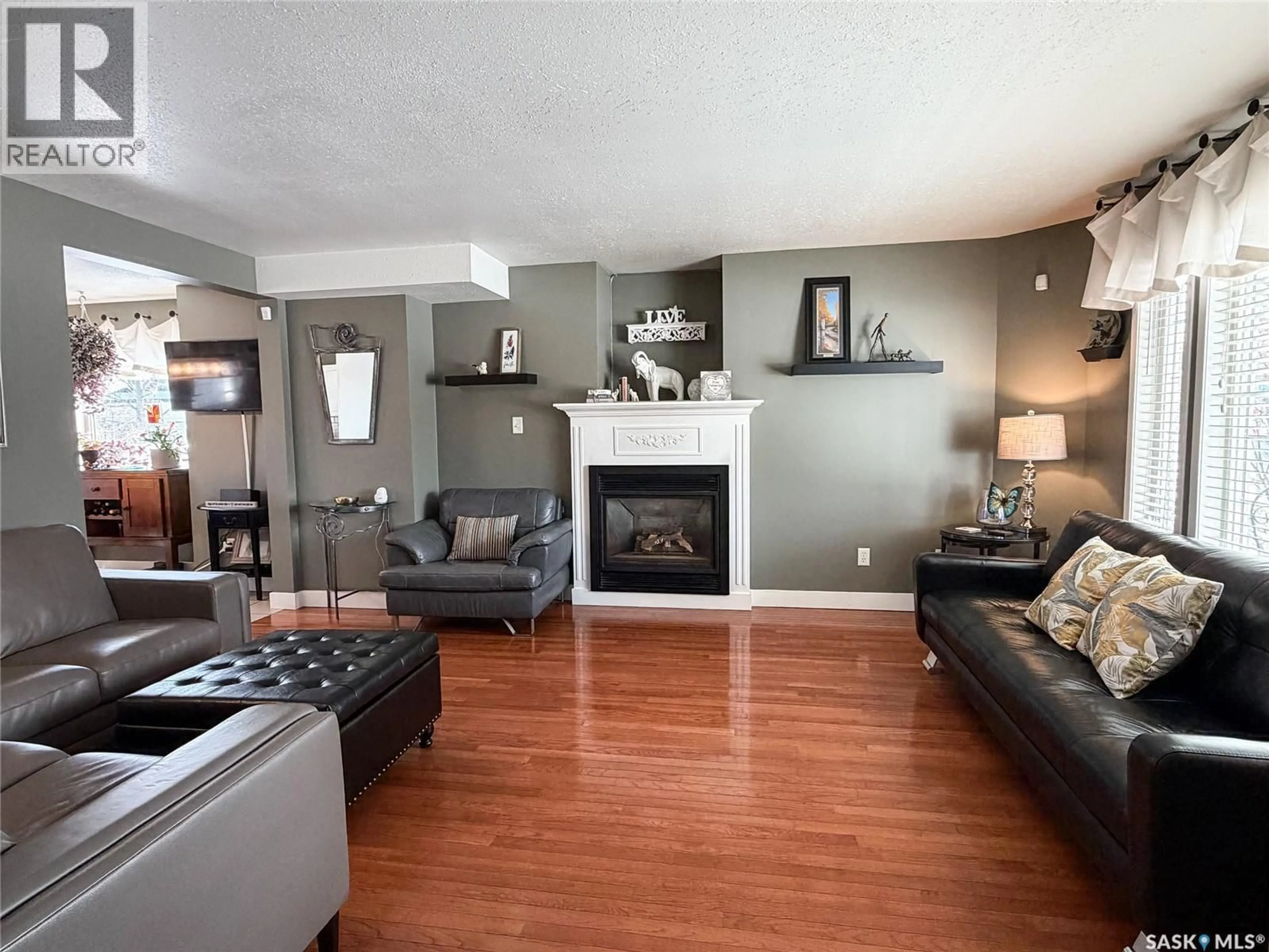 Living room with furniture, wood/laminate floor for 1 MORIN CRESCENT, Meadow Lake Saskatchewan S9X1Z8
