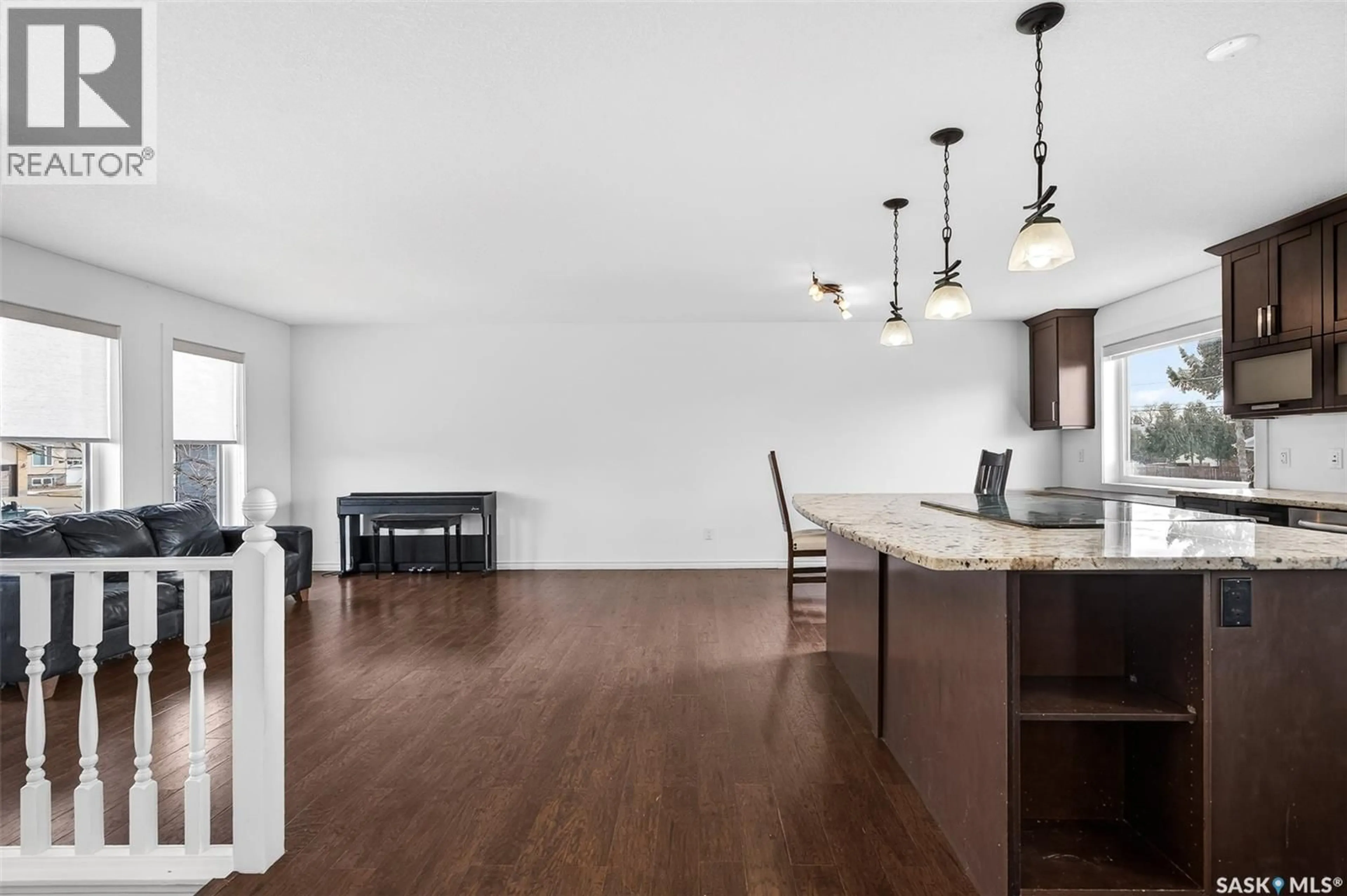 Open concept kitchen, wood/laminate floor for 1149 PRINCE CHARLES PLACE, Moose Jaw Saskatchewan S6H7V2