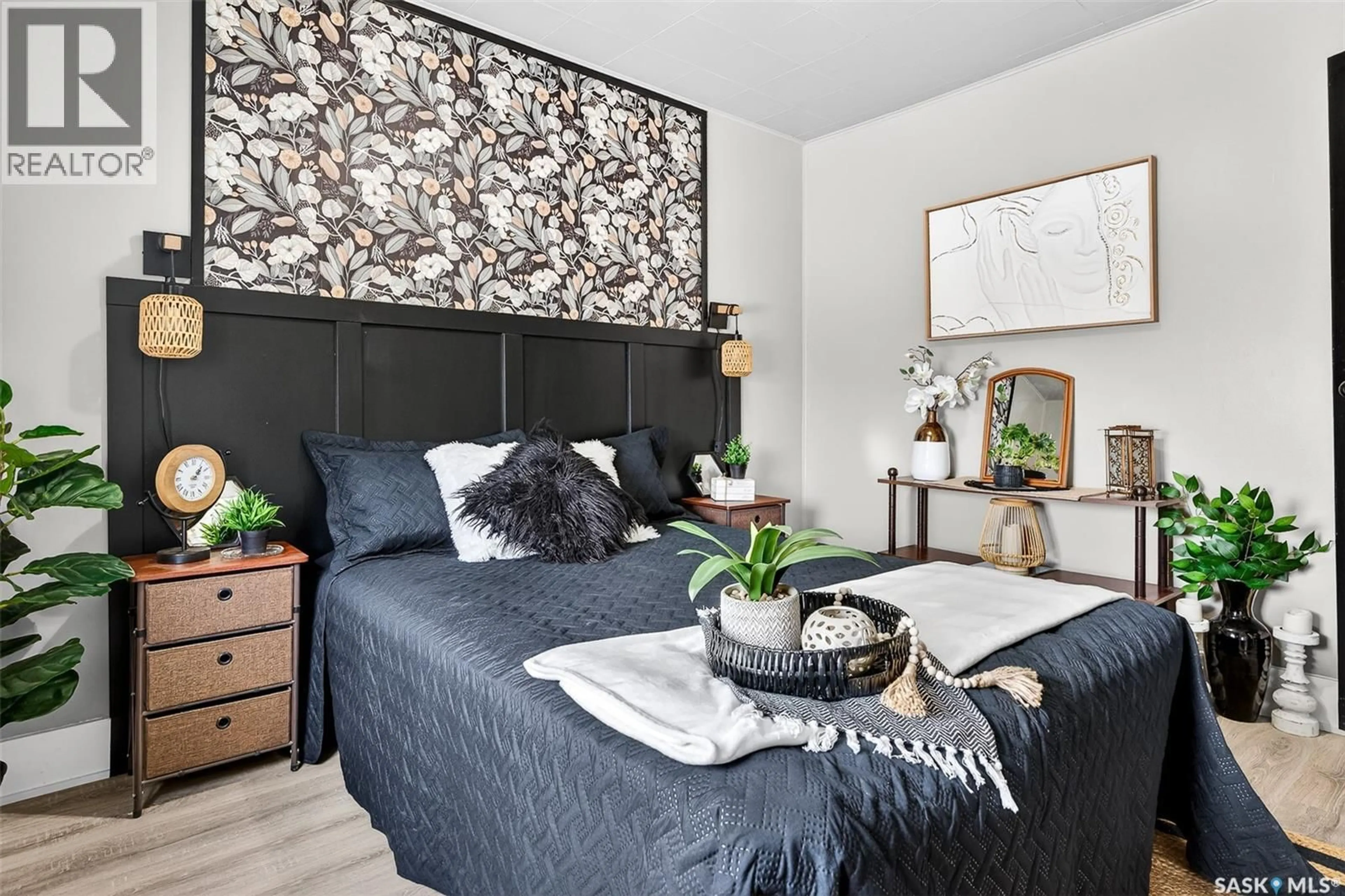 Bedroom with bed, wood/laminate floor for 75 ELSOM STREET, Moose Jaw Saskatchewan S6H4T9