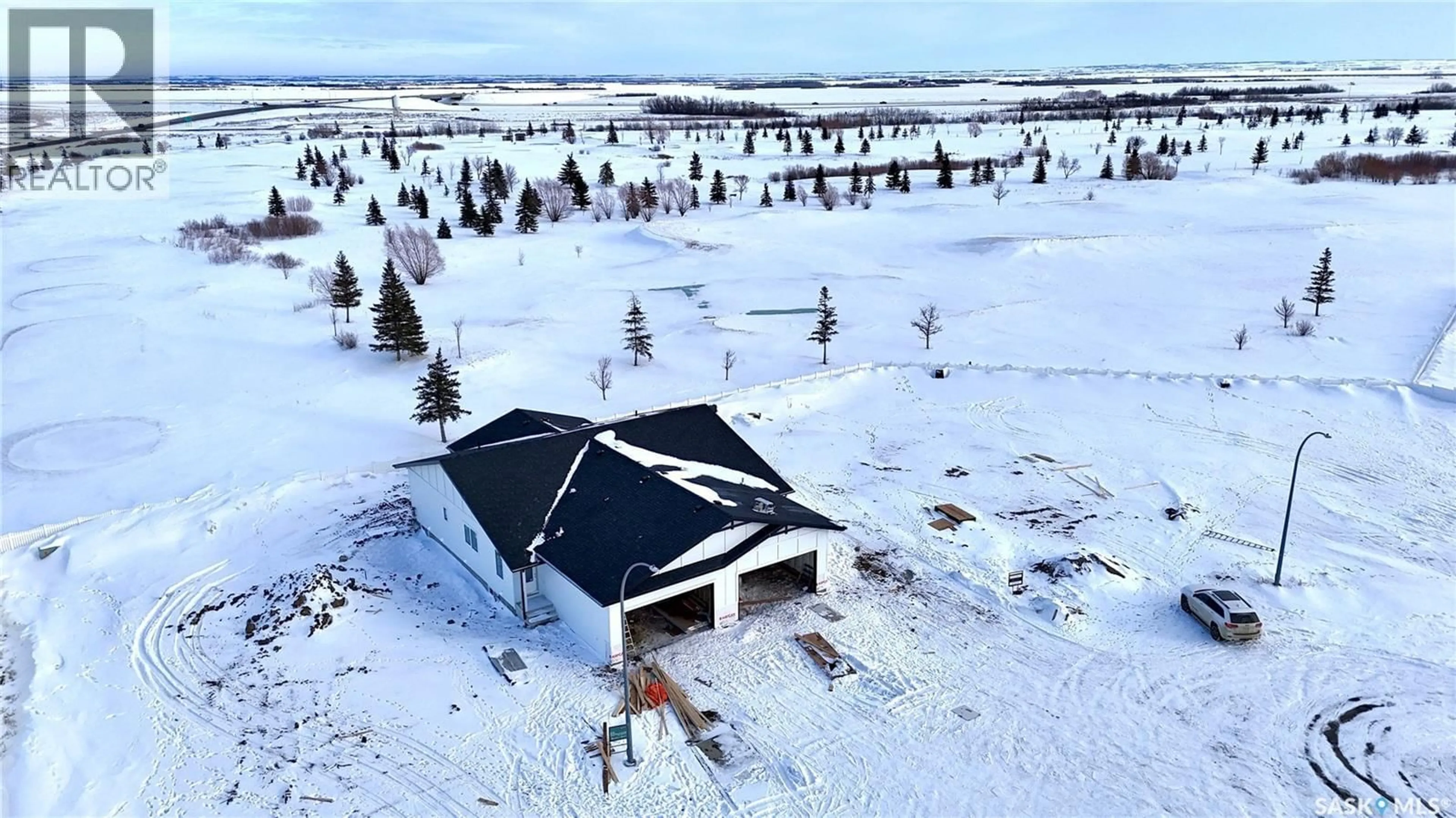 A pic from outside/outdoor area/front of a property/back of a property/a pic from drone, unknown for 858 DELAET BAY, Warman Saskatchewan S0K4S0