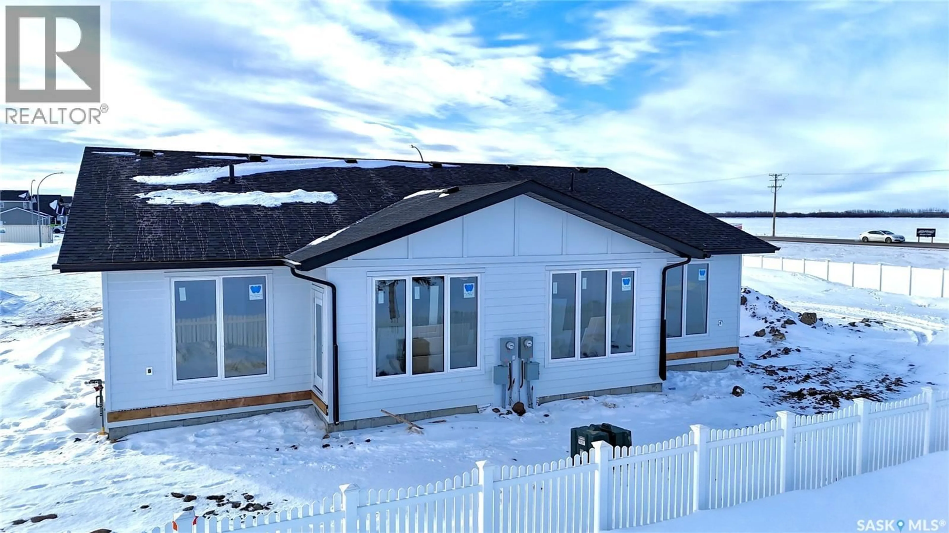 A pic from outside/outdoor area/front of a property/back of a property/a pic from drone, building for 858 DELAET BAY, Warman Saskatchewan S0K4S0